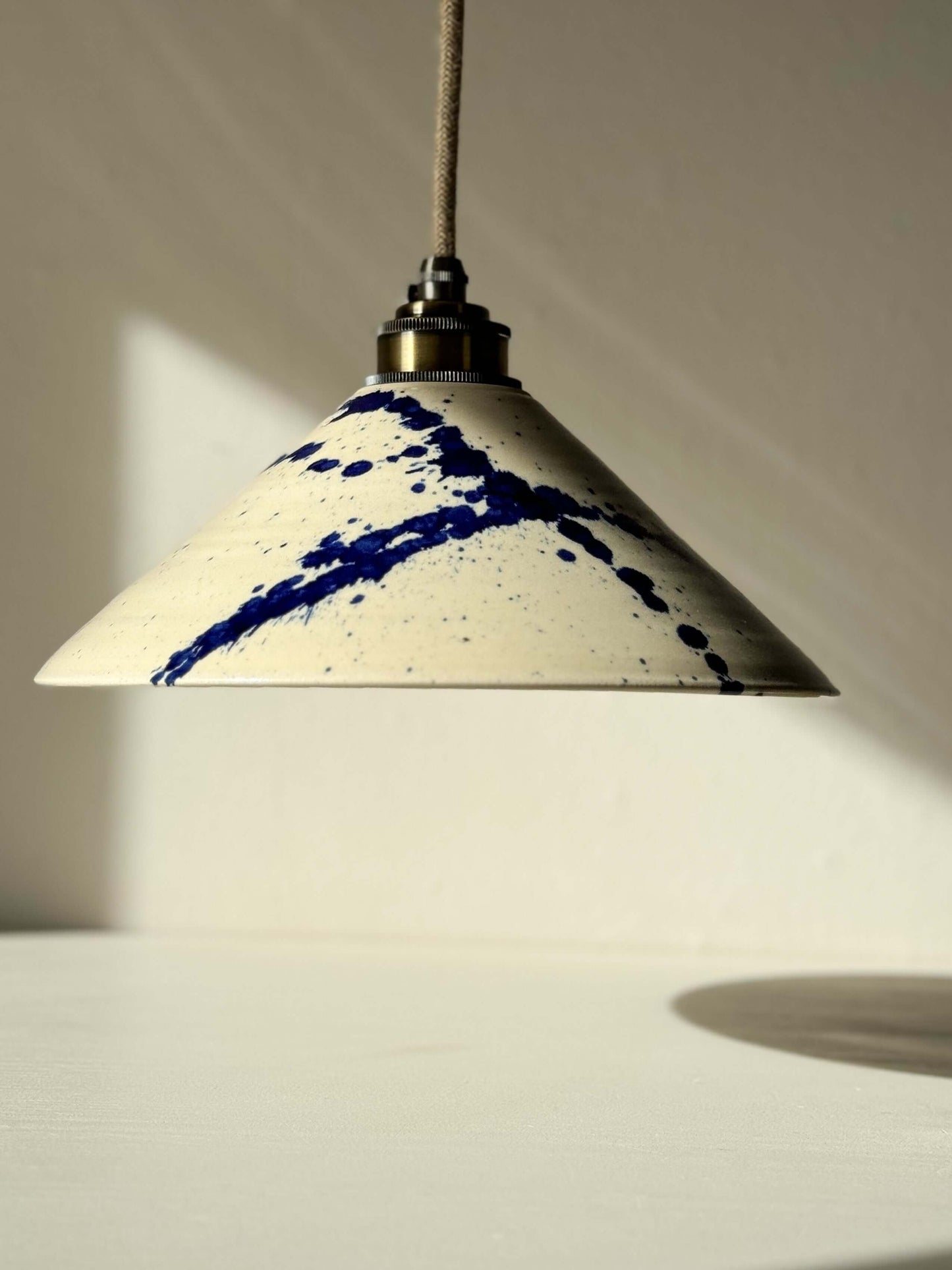Handmade ceramic lamp shade with cobalt blue splashes from the Gosu Series #06, featuring a glossy finish and unique design.