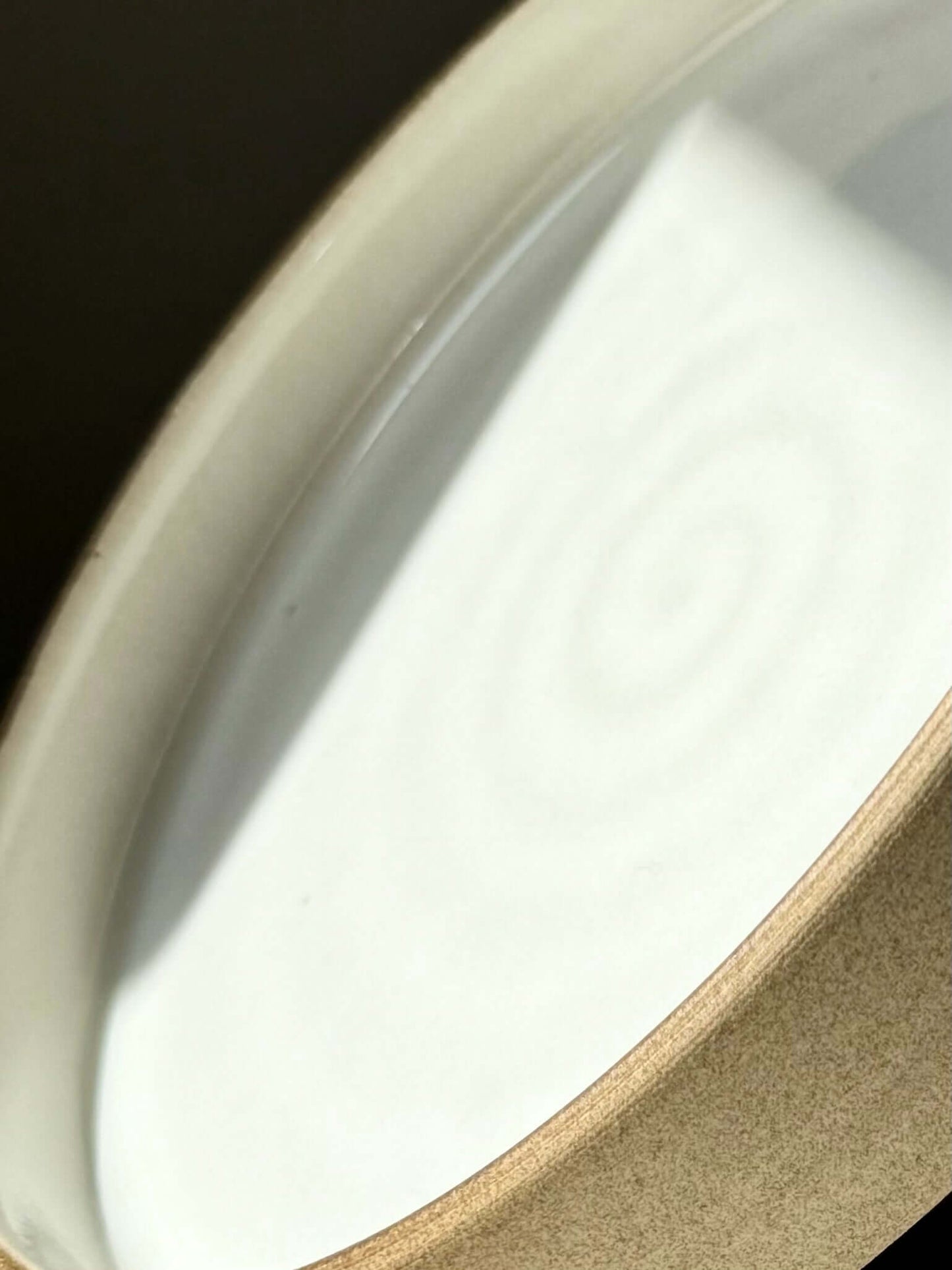 Close-up of handmade ceramic Large Plate – Yuki Series with white glaze and toffee clay.