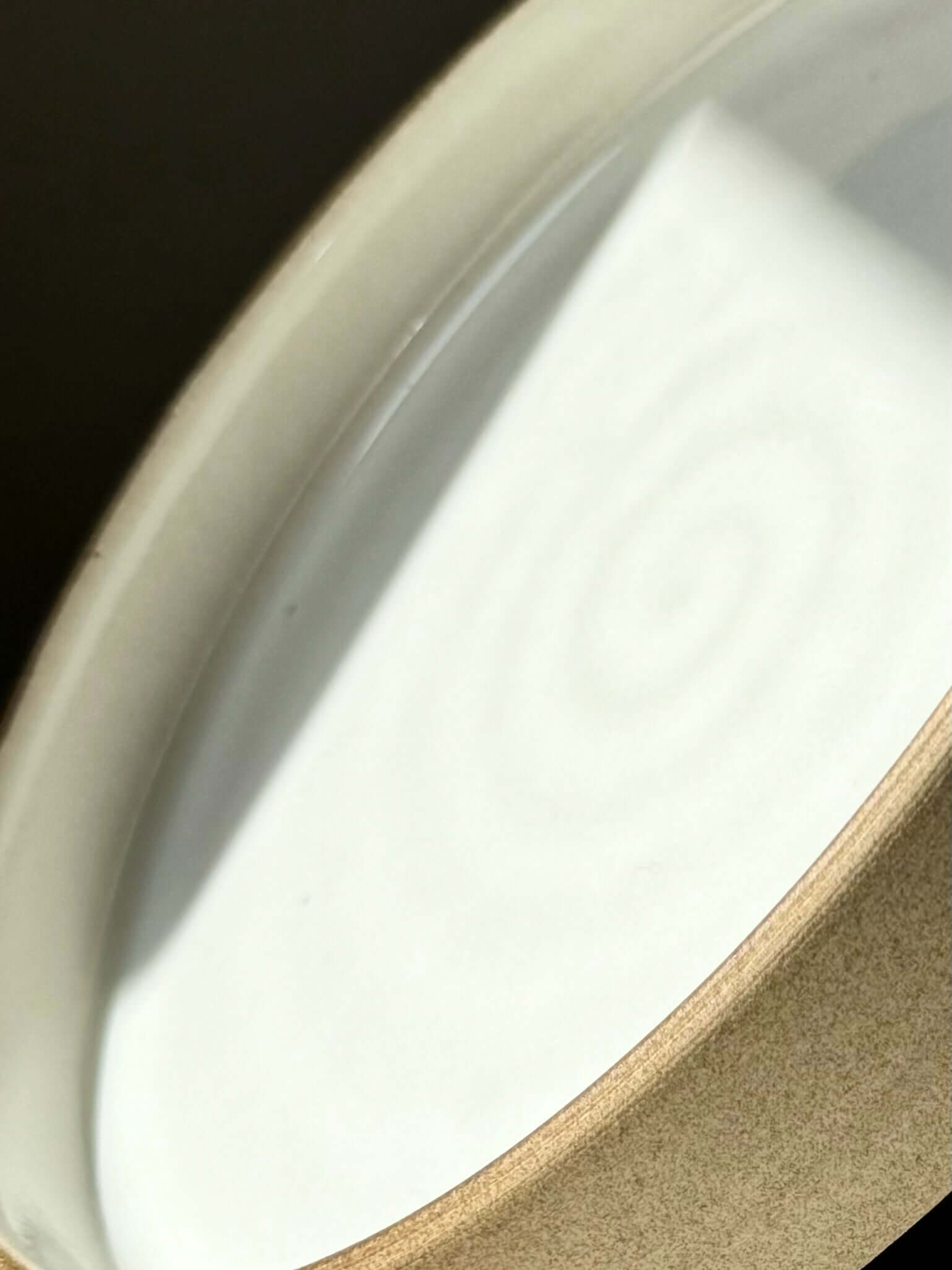 Close-up of handmade ceramic Large Plate – Yuki Series with white glaze and toffee clay.