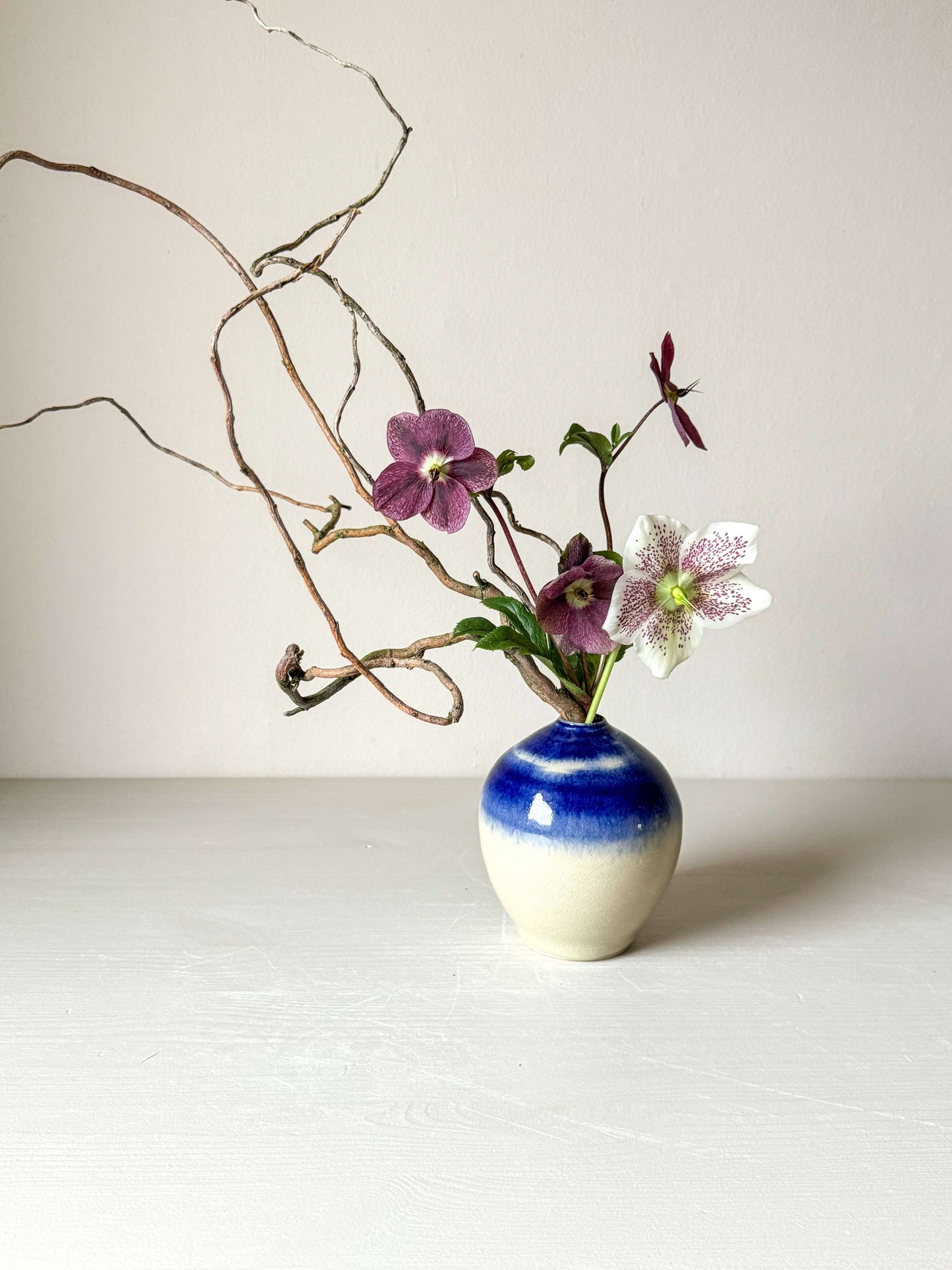 Gosu Series ceramic vase with cobalt blue glaze, showcasing unique floral arrangement in a minimalist setting. Perfect blend of tradition and modern charm.