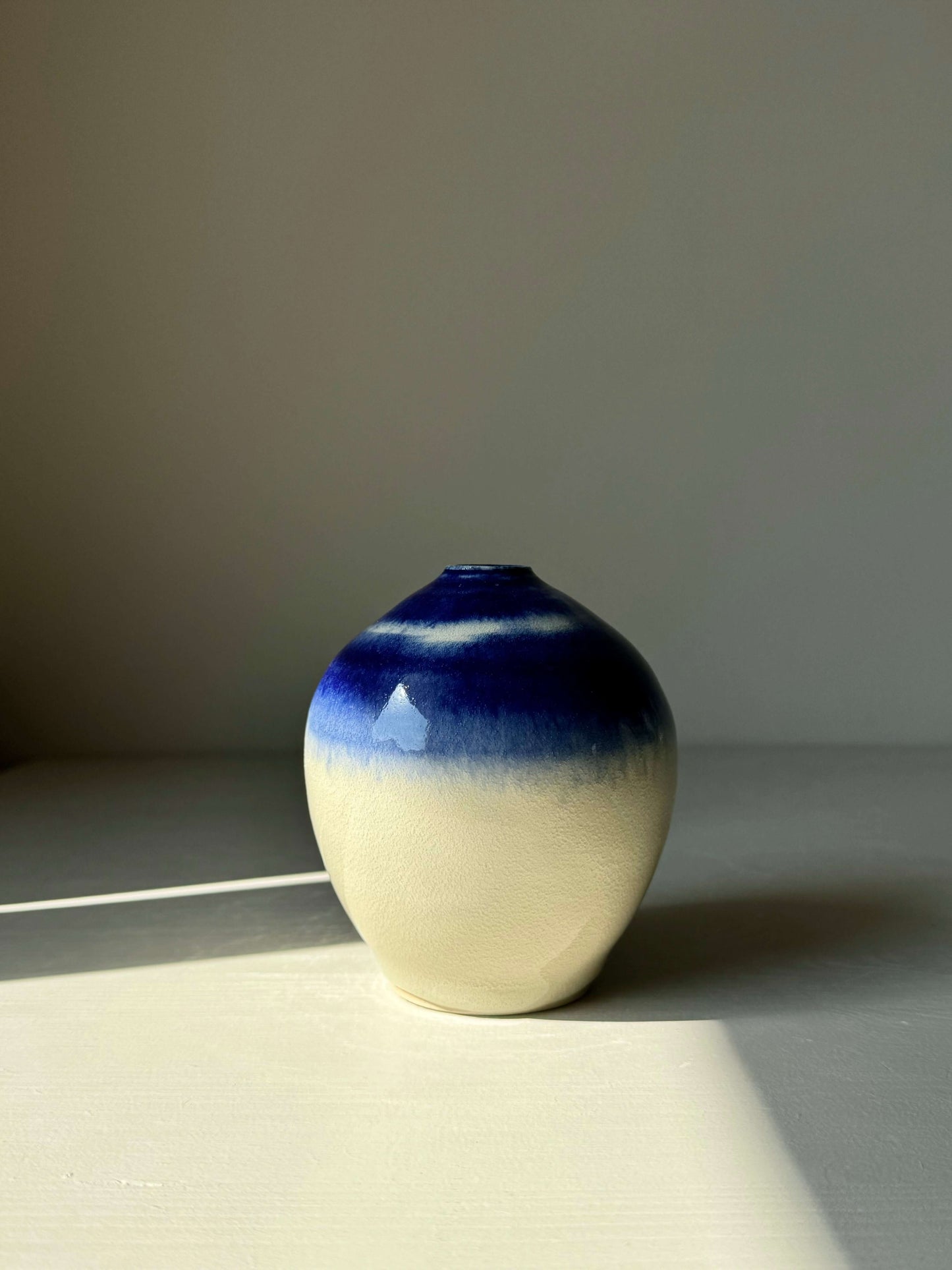Ceramic vase from Gosu Series with cobalt blue glaze, 10.5 cm tall, 9.5 cm in diameter, featuring glossy clear finish for modern charm.