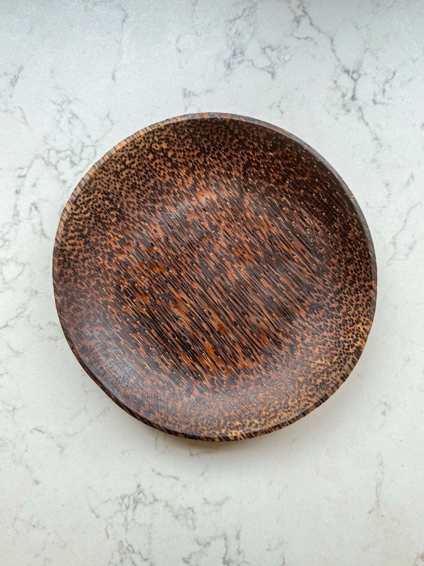Coconut Wood Side Plate with unique grain pattern, handcrafted in Marrakech, perfect for adding natural warmth to dining settings.