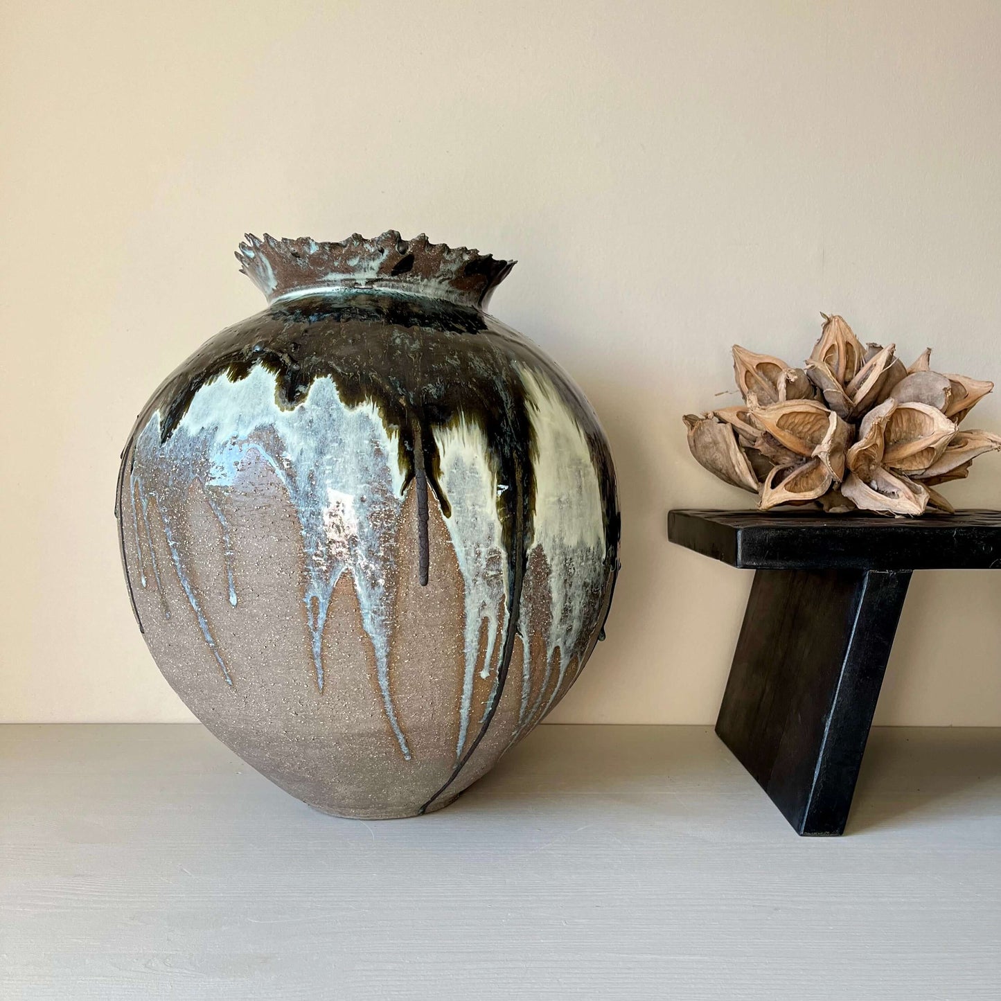 Handmade ceramic Extra Large Hand built Vase with unique glaze, next to wooden decor on display.