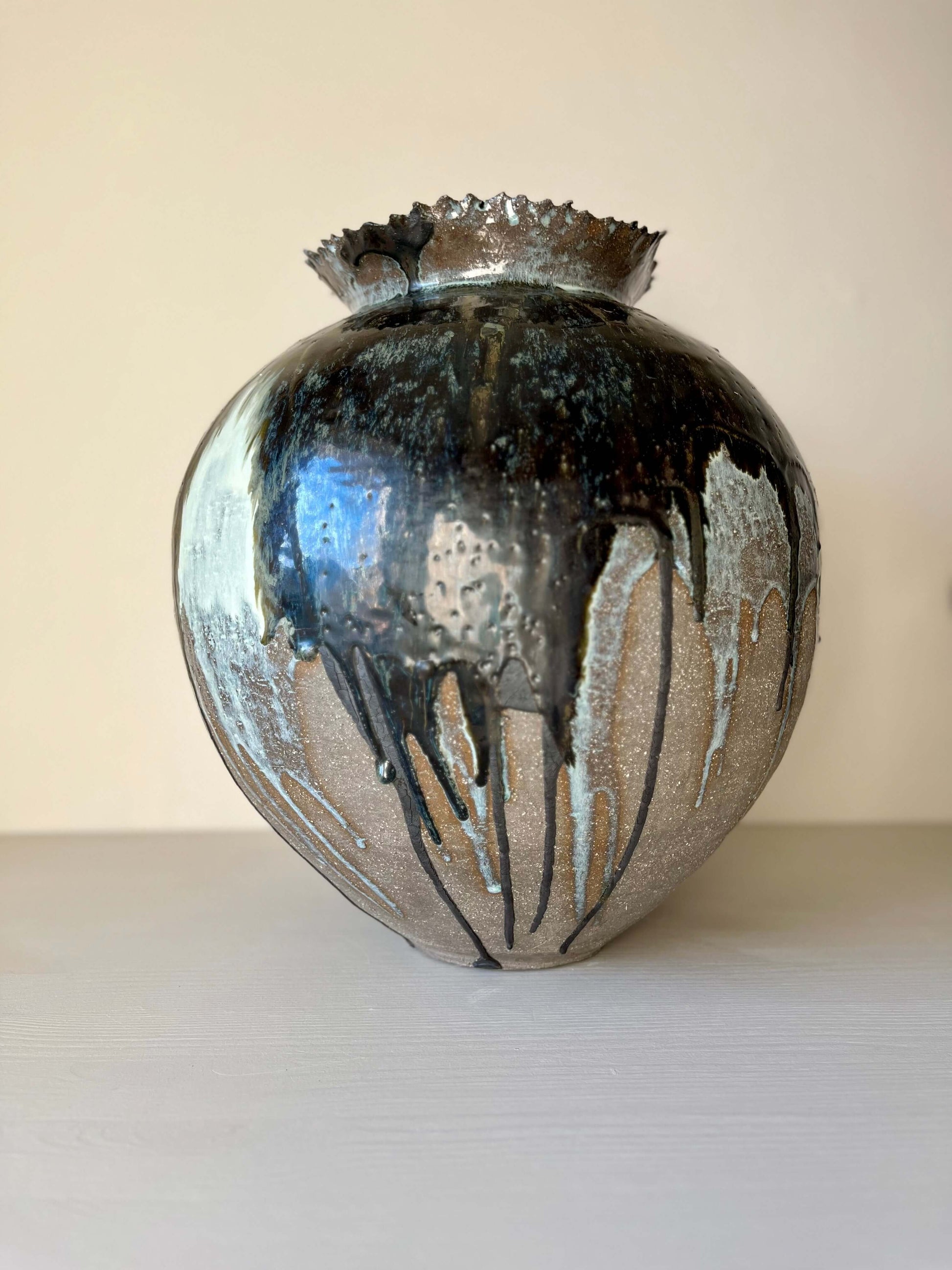 Extra Large Hand built Vase, a handmade ceramic piece with unique glaze, showcasing craftsmanship and elegance, sitting on a shelf.