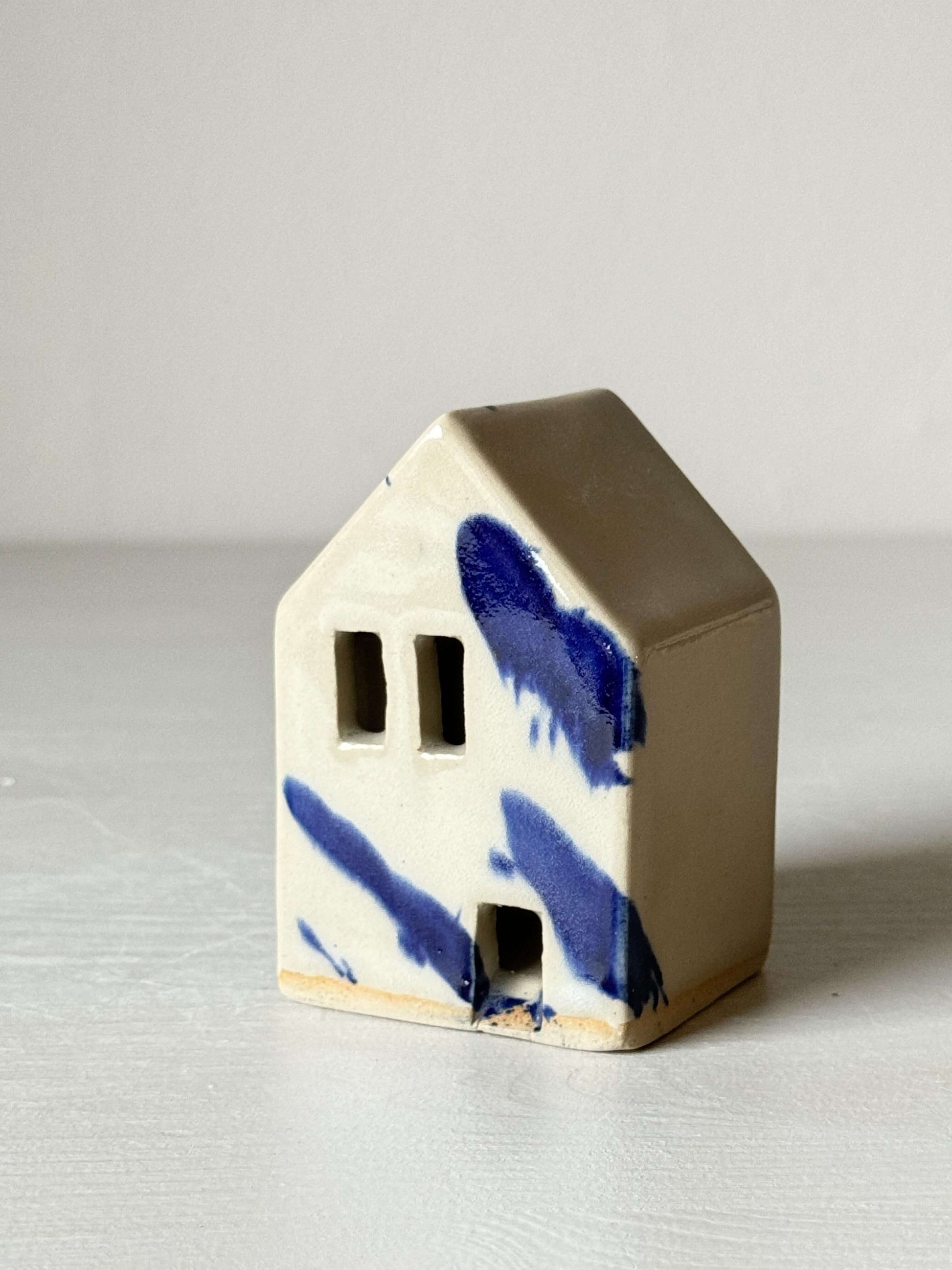 Handbuilt Ceramic Houses – Gosu Series, handmade ceramic house with cobalt blue splashes and a quirky, Dutch-style design.
