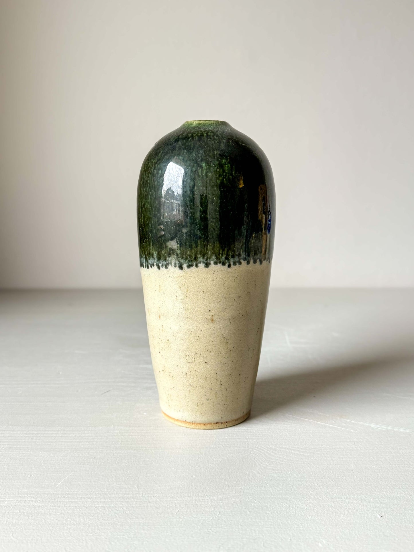Handcrafted ceramic vase with glossy clear glaze and soft green rim, 18 cm tall, perfect for adding a natural touch to home decor.