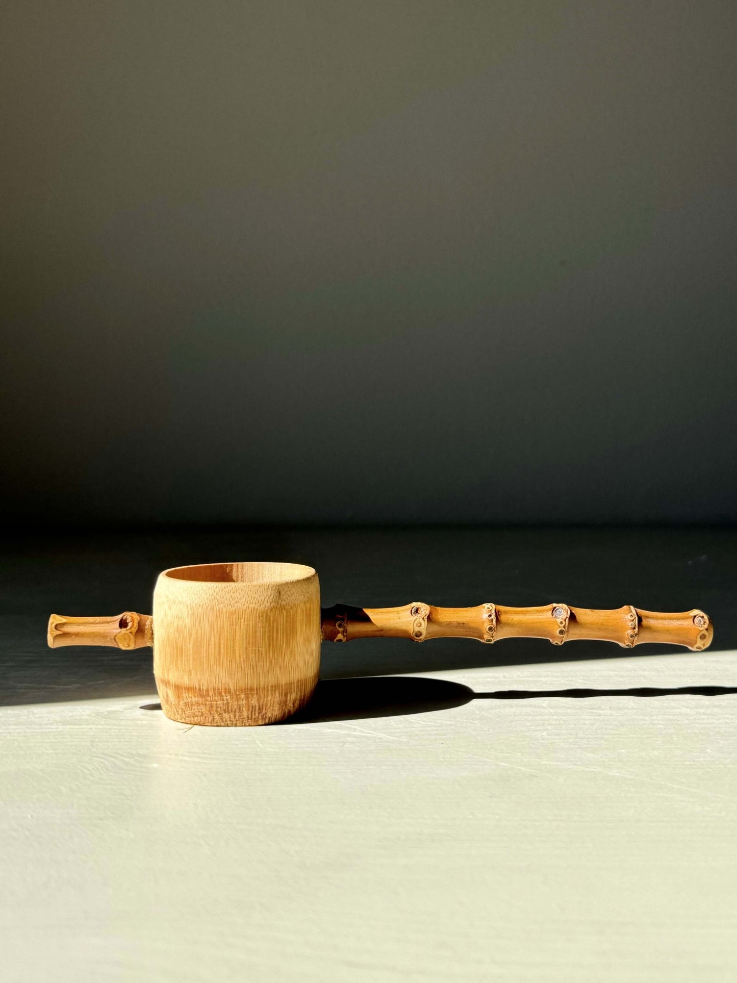 Handmade bamboo tea strainer with rustic charm, designed for easy tea brewing and balancing on cups; lightweight and durable.