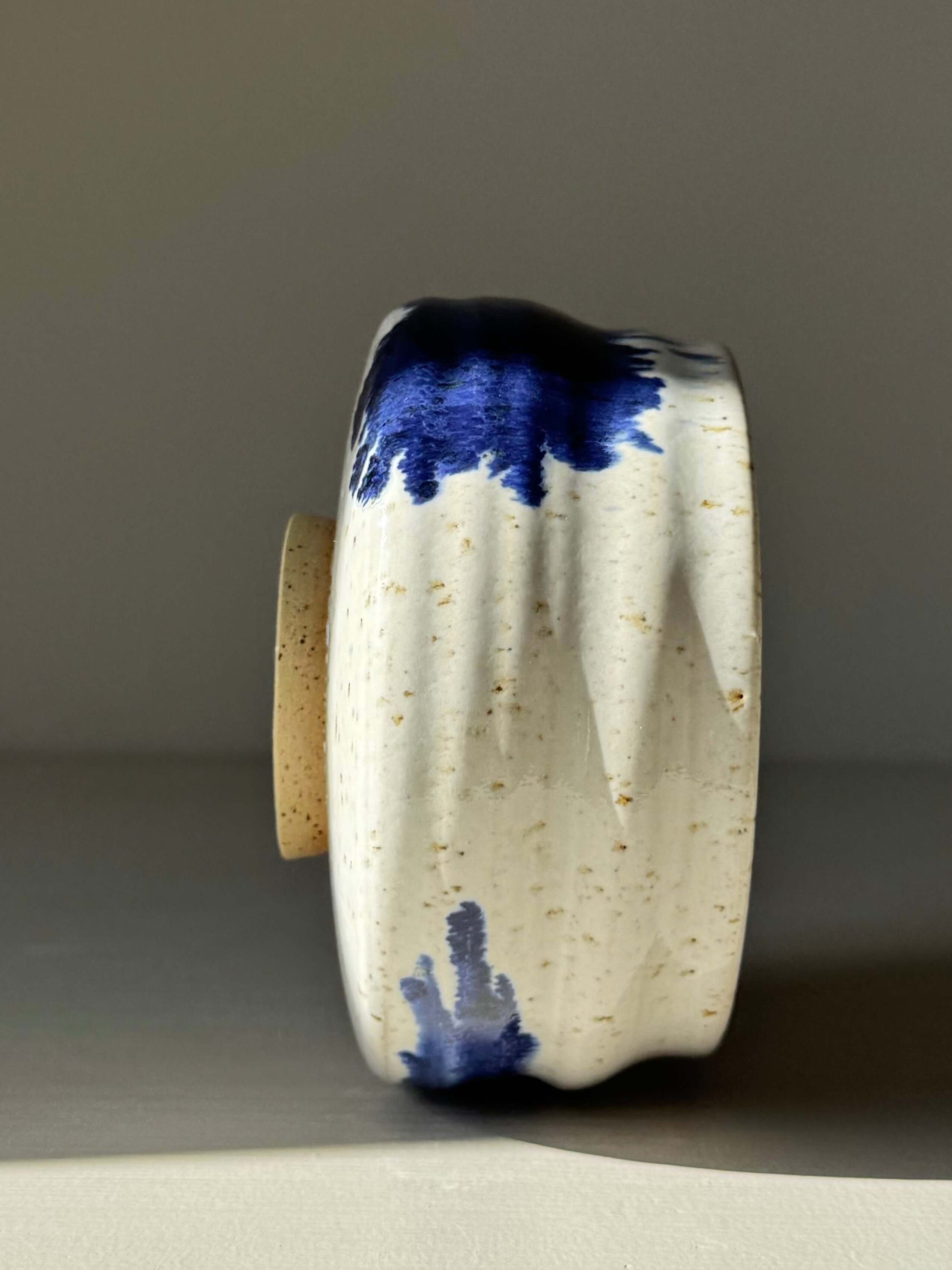 Handmade ceramic Matcha Bowl – Cobalt Blue & Glossy White #02 with unique splash pattern and sculptural ridged design.
