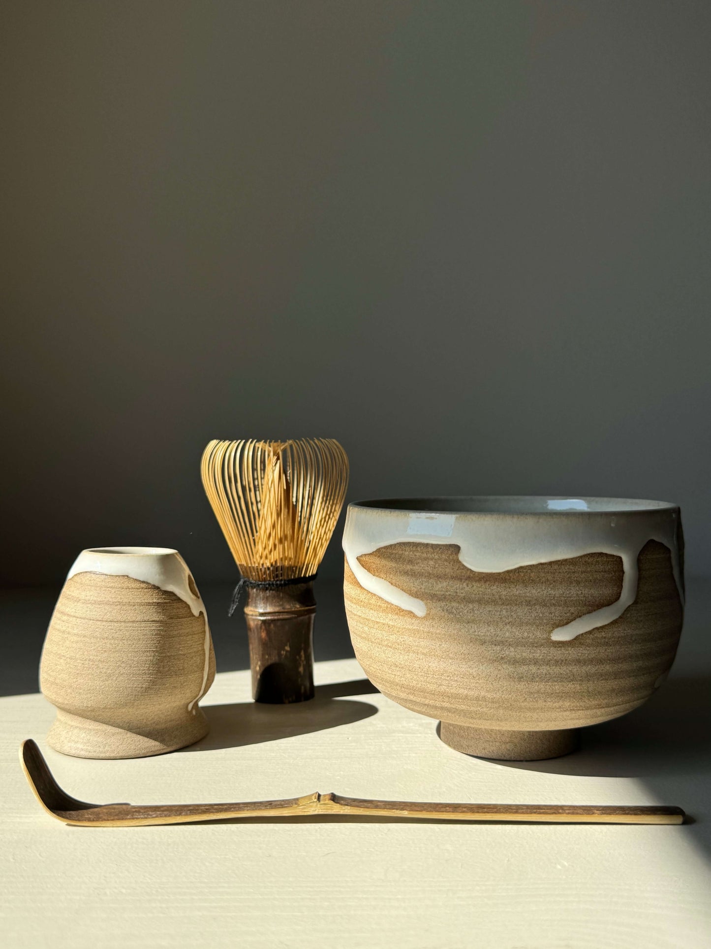 Yuki Series Matcha bowl set with toffee clay and white glaze, featuring handmade whisk holder and matcha scoop for a calming ritual.
