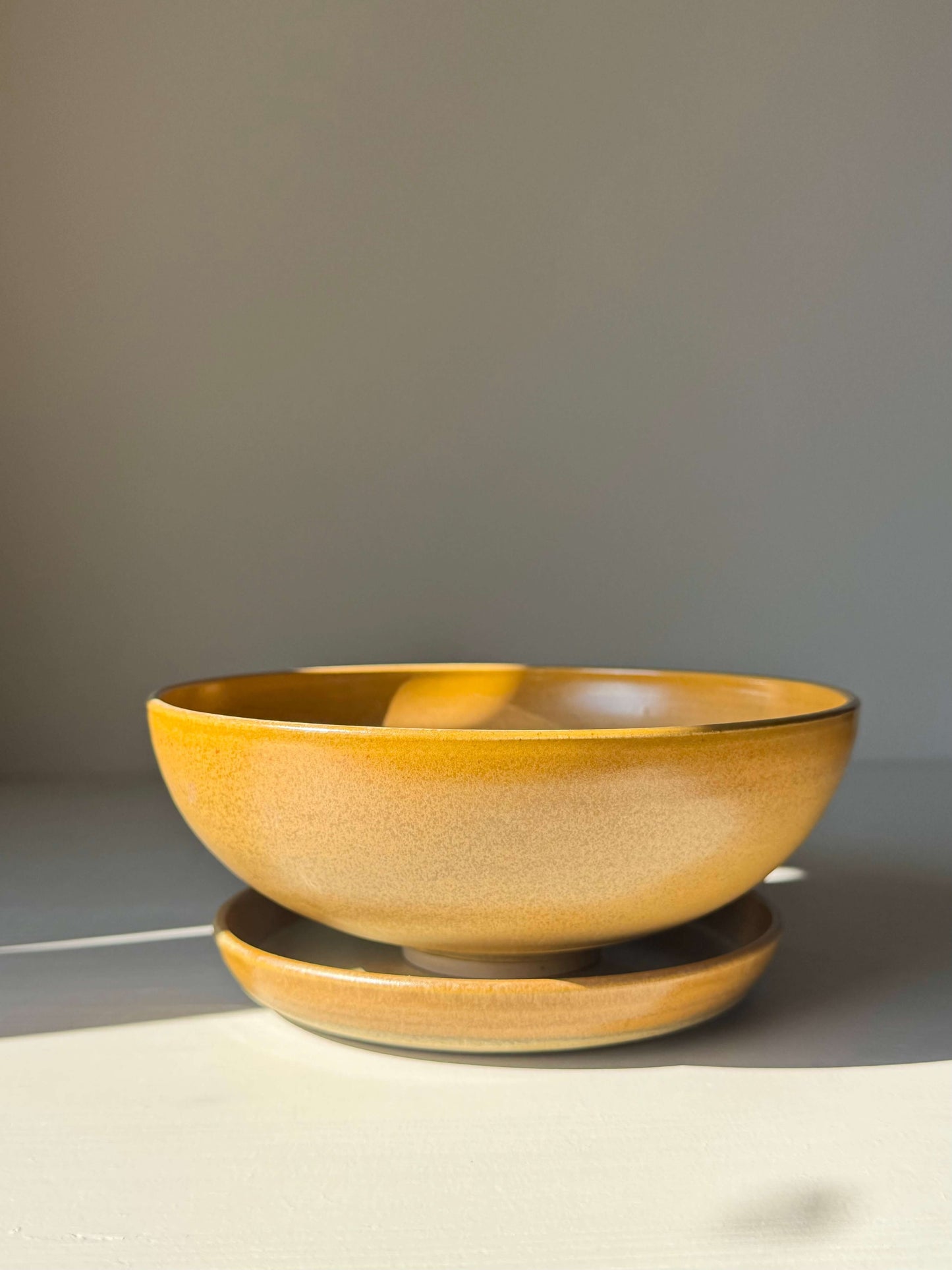 Handmade ceramic Berry Bowl - Golden Yellow, 17.5 cm diameter, glazed in warm golden yellow for rinsing and serving fresh fruit.