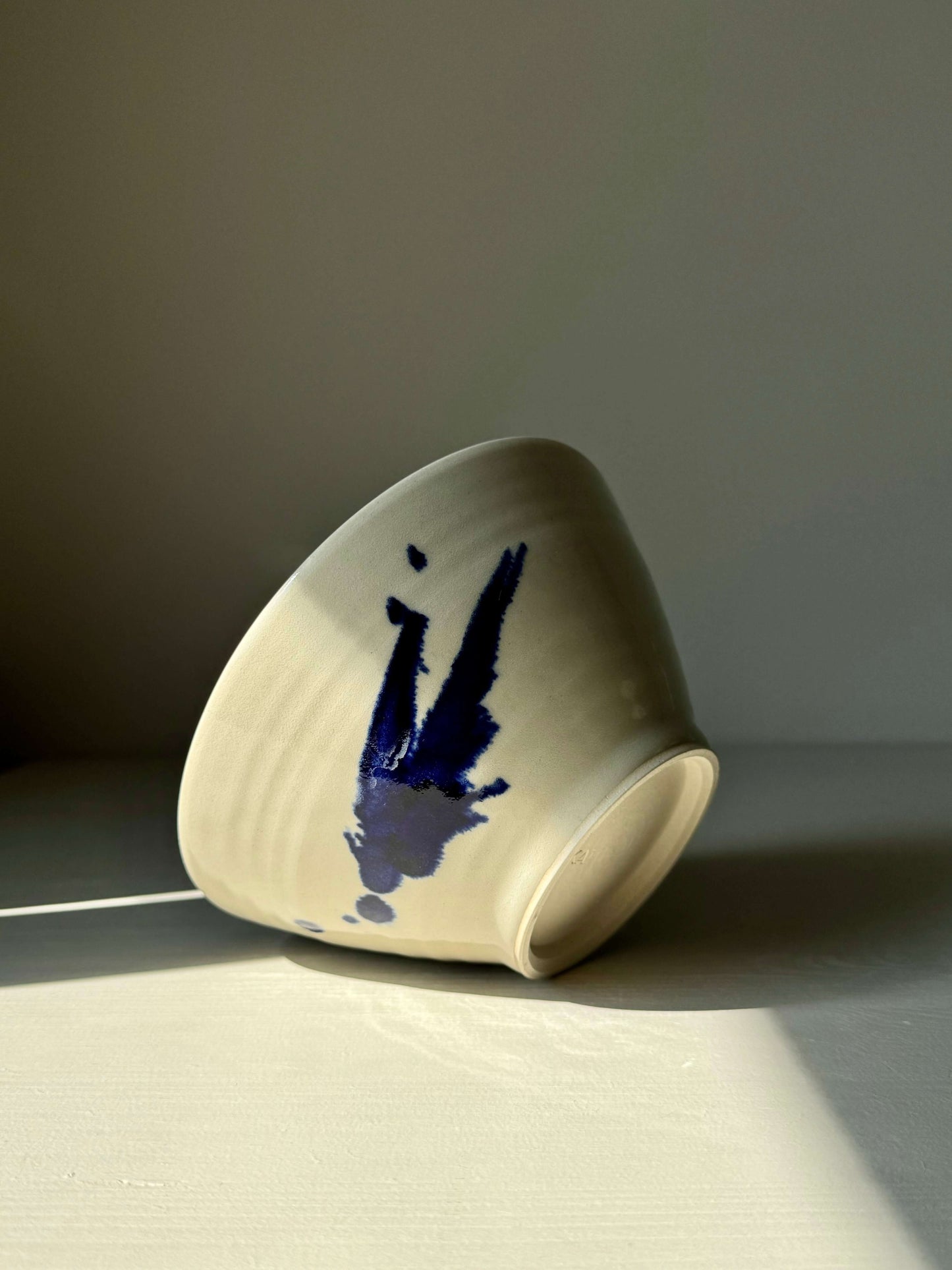 Handmade ceramic breakfast bowl with cobalt blue accents from the Gosu Series, showcasing unique artistry and functionality.
