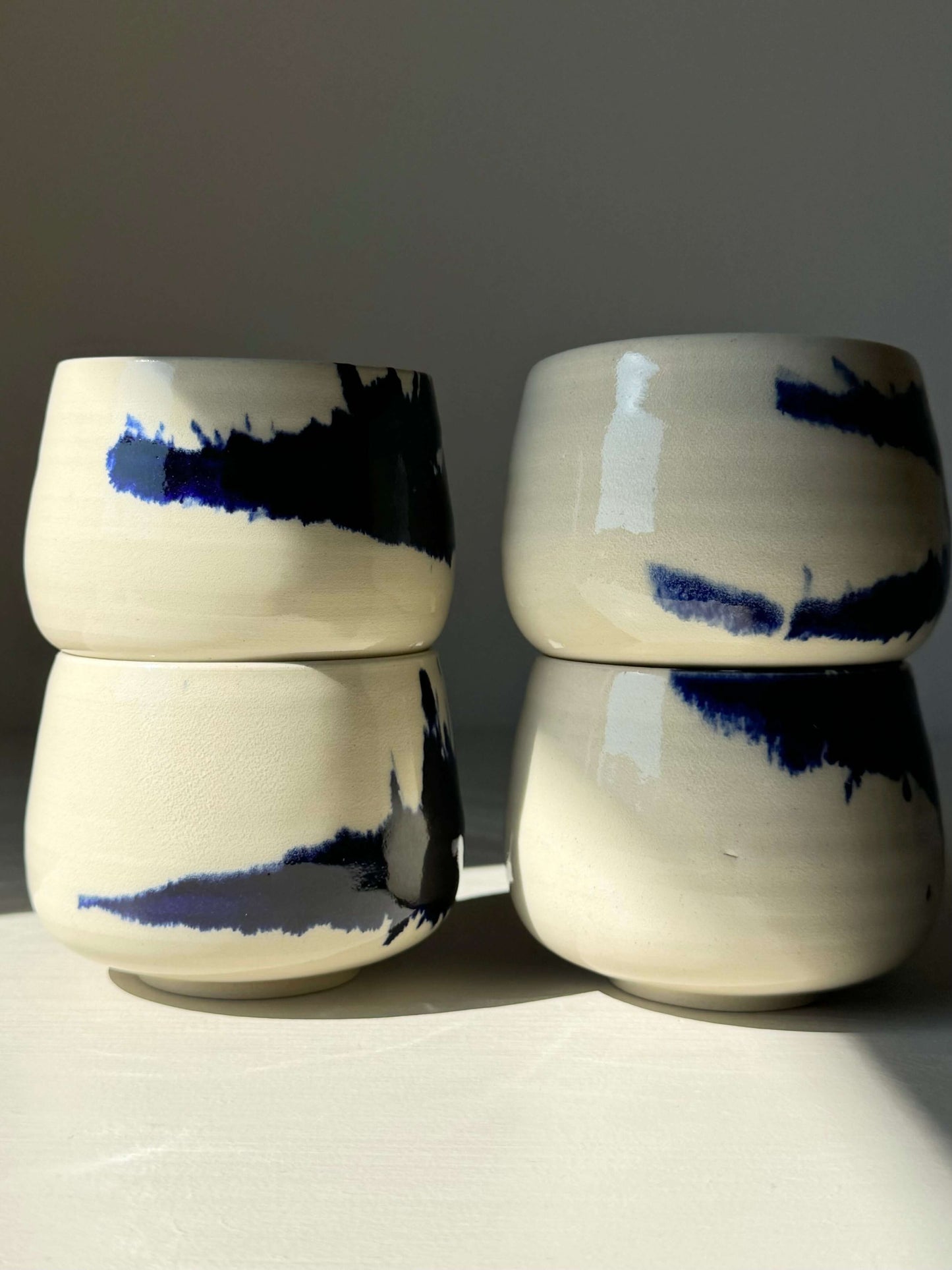 Handmade Gosu Series ceramic coffee cups with cobalt blue splashes, displaying simplicity and bold design. Size 8cm x 8cm, Capacity 275ml.