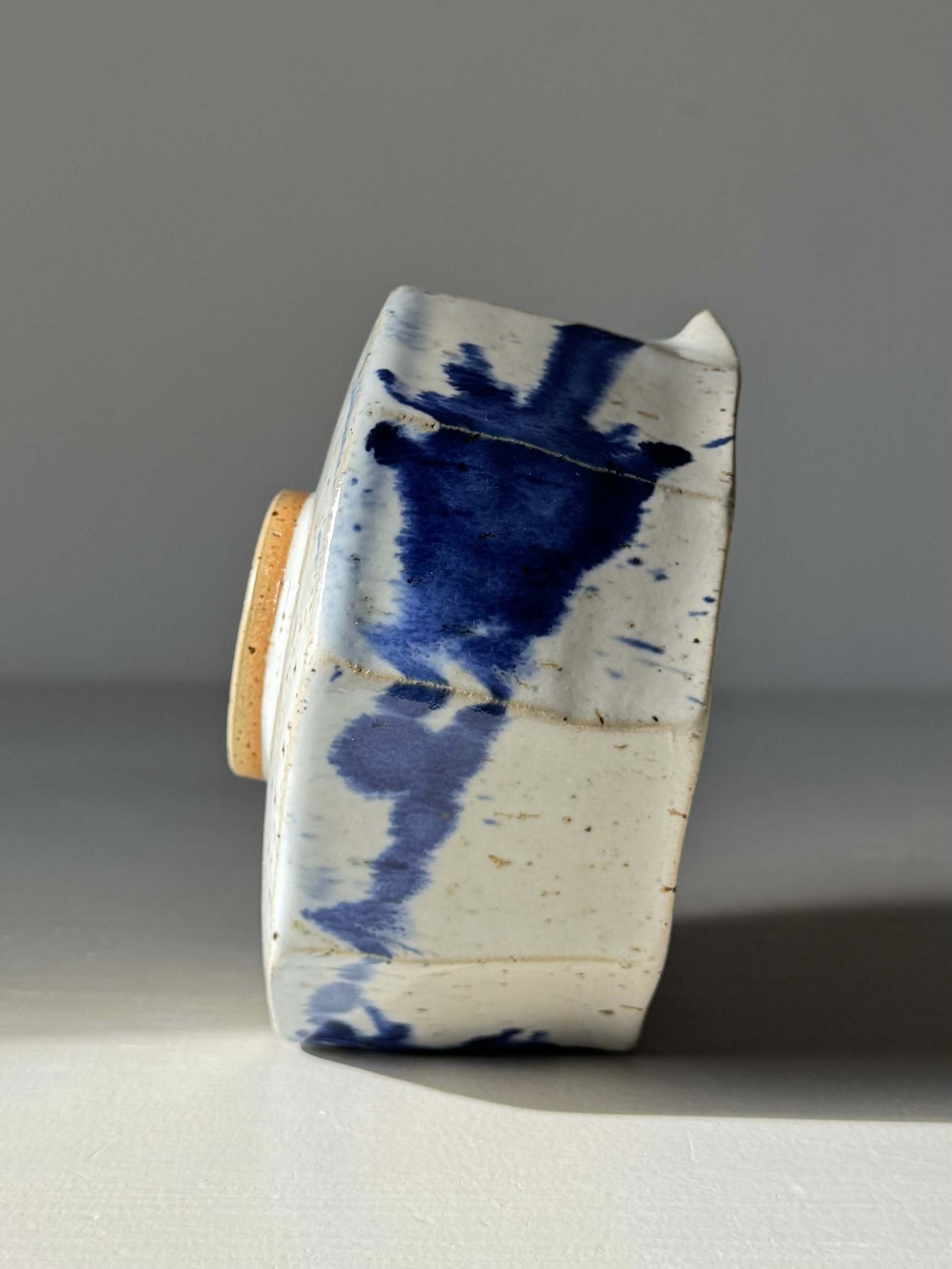 Handmade ceramic Faceted Matcha Bowl with Spout – Cobalt Blue & Glossy White Glaze #011 with unique faceted design and blue accents.