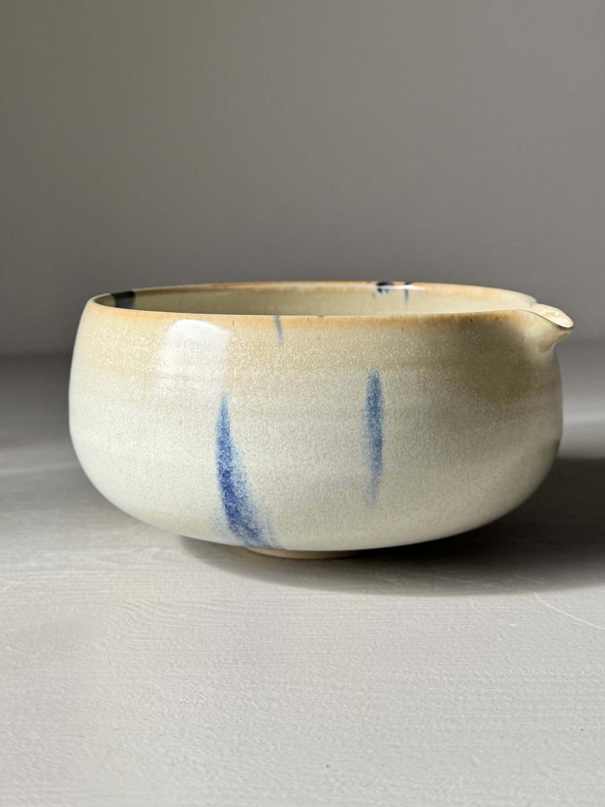 Handmade ceramic Katakuchi Matcha Bowl with Spout - Cobalt Blue & Moonstone Glaze, showcasing unique speckled design and smooth pouring spout.
