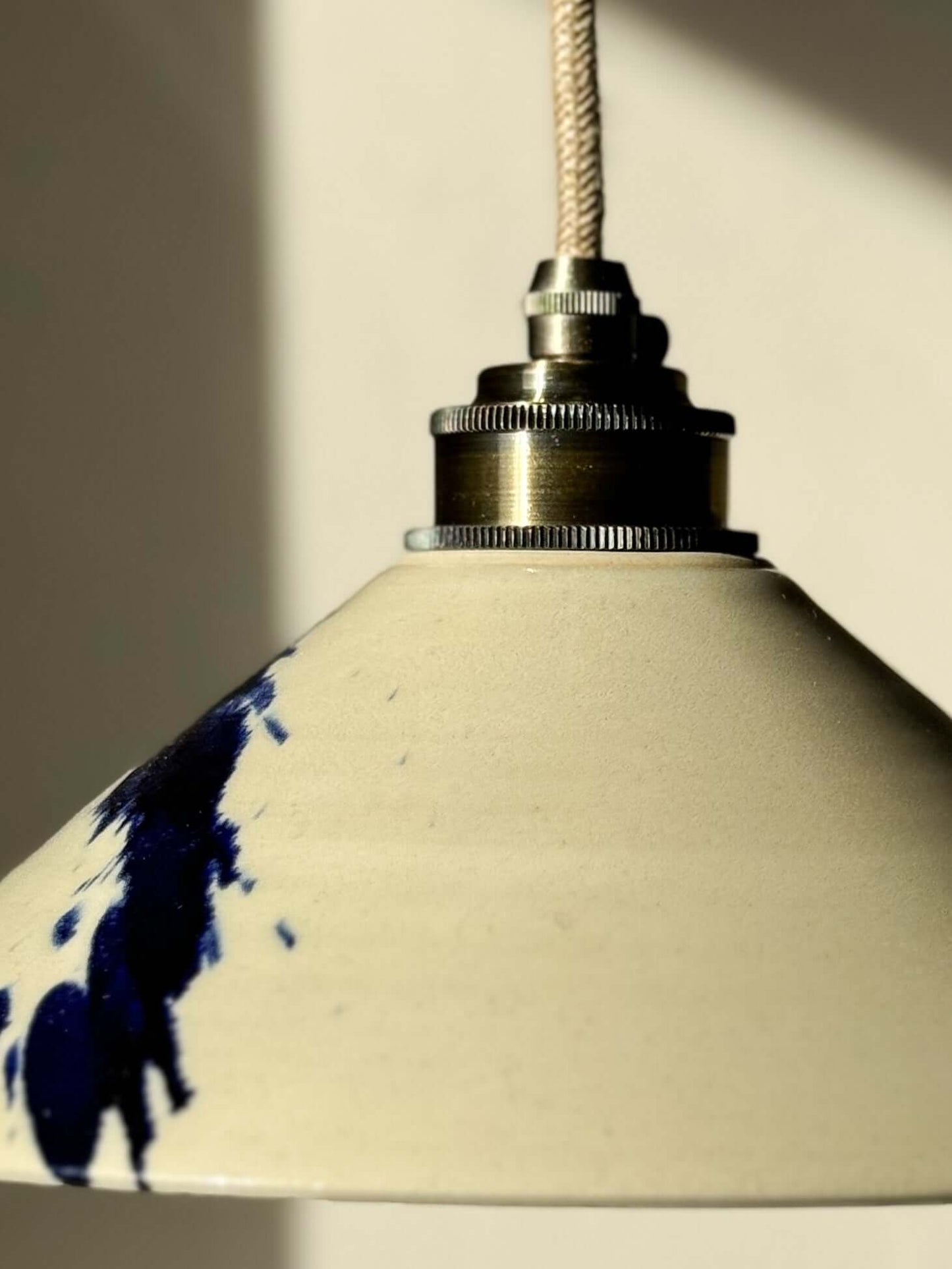 Handmade ceramic lamp shade from Gosu Series with cobalt blue accents and glossy finish.