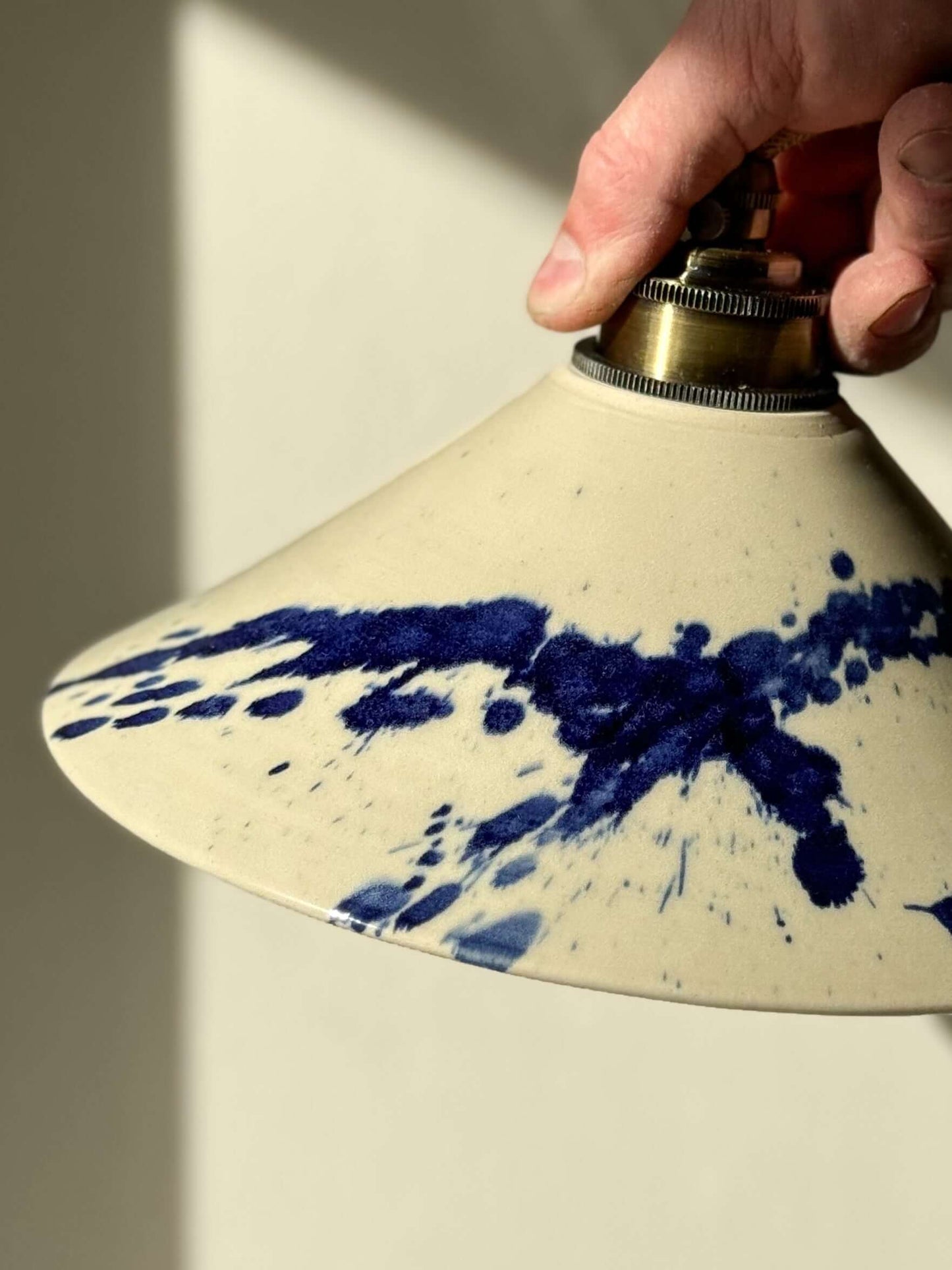 Handmade ceramic lamp shade with splash cobalt blue design from the Gosu Series, featuring unique hand-thrown craftsmanship.