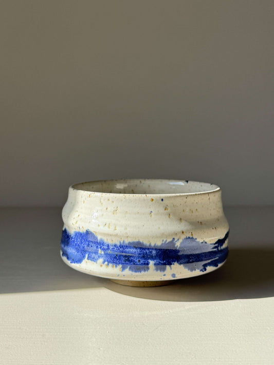 Handmade ceramic Matcha Bowl – Cobalt Blue & Glossy White #02 with vibrant splash pattern on a rounded form.