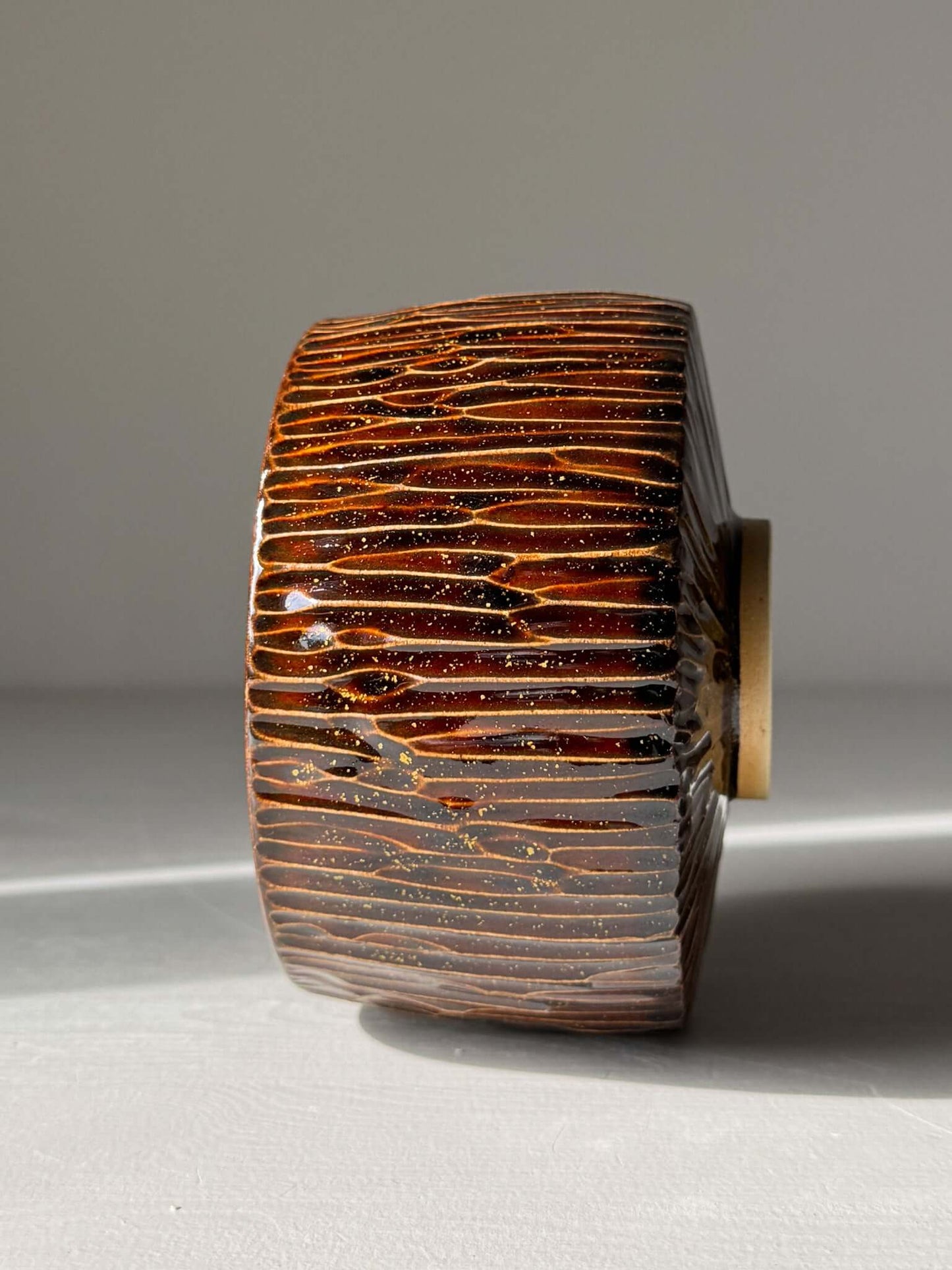 Matcha Bowl – Kinsei #02 handmade ceramic with glossy brown carved exterior and gold spiral interior
