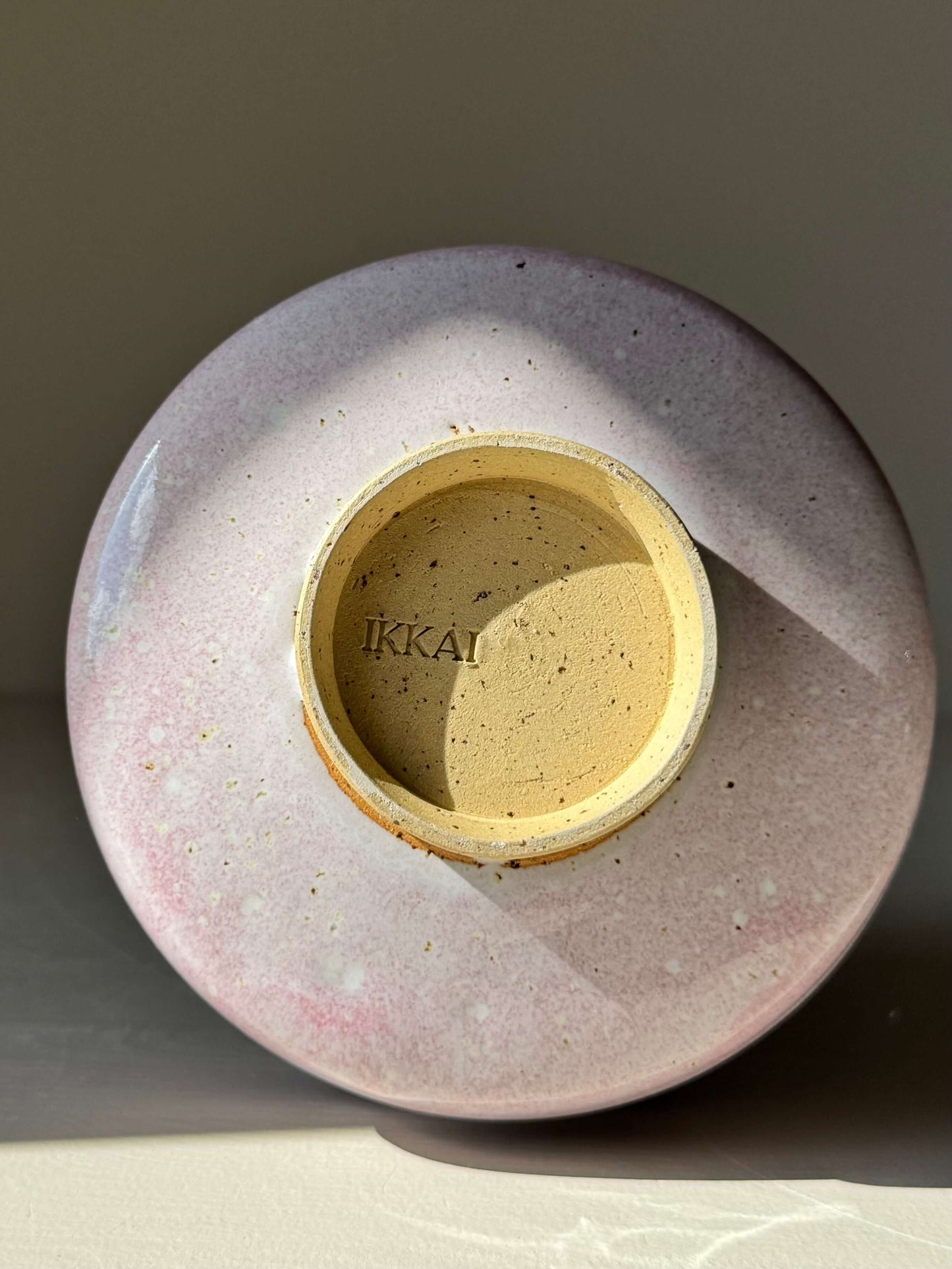 Base view of handmade ceramic Matcha Bowl - Pale Pink with pale pink glaze and unique crafted texture.