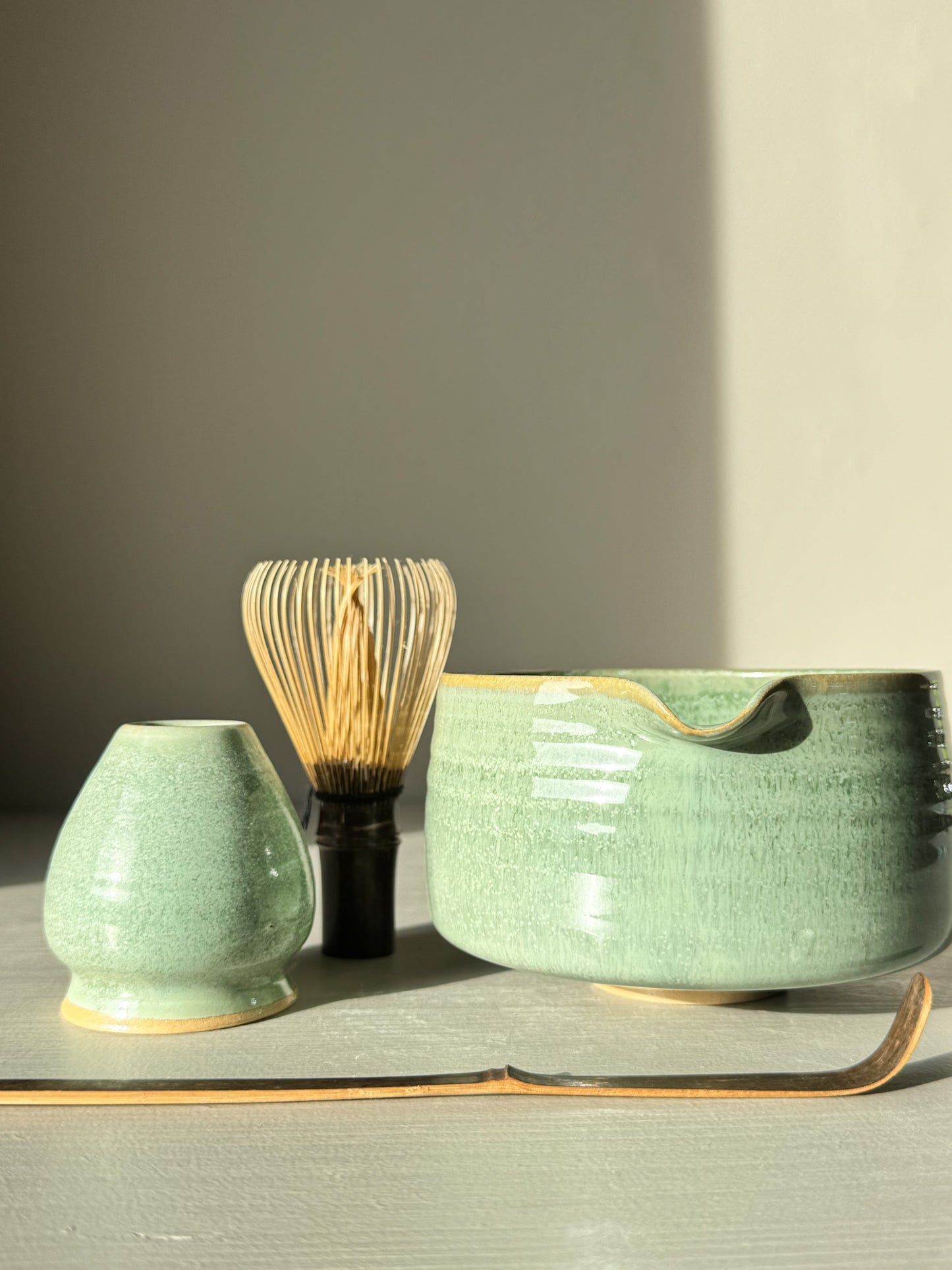 Matcha Bowl Spout – Sage #03 with bamboo whisk and scoop in sunlight