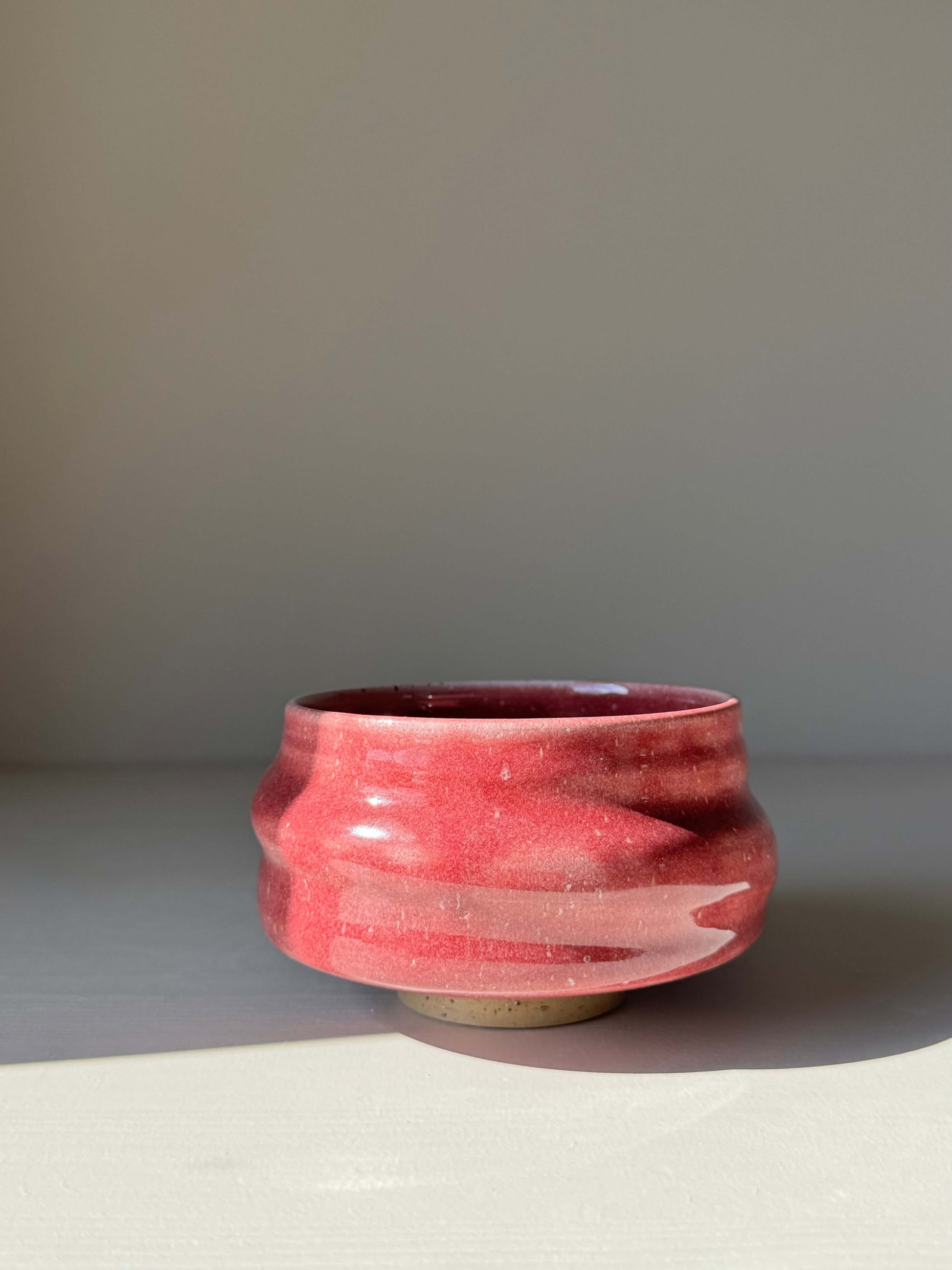 Handmade ceramic Matcha Bowl - Ume Series #07 in red, inspired by Japanese Ume blossom, featuring a rounded shape and wide foot.