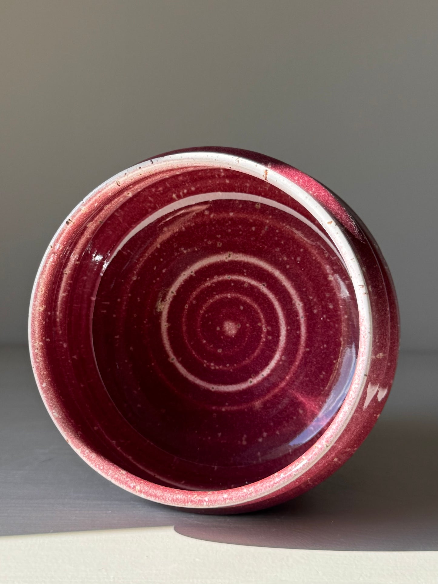 Handmade ceramic Matcha Bowl - Ume Series #08, inspired by Japanese Ume blossom, showcasing sculptural ridges and deep red hues.