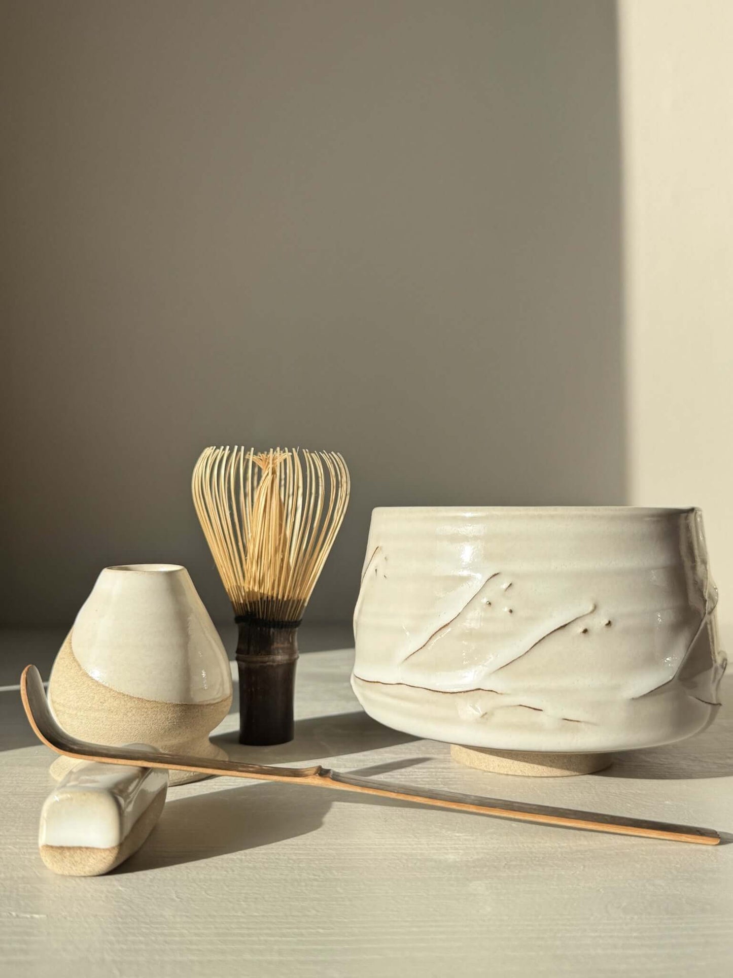 Matcha Bowl – Yuki Branches #02 with traditional tea utensils, featuring soft ivory glaze and delicate slip lines.