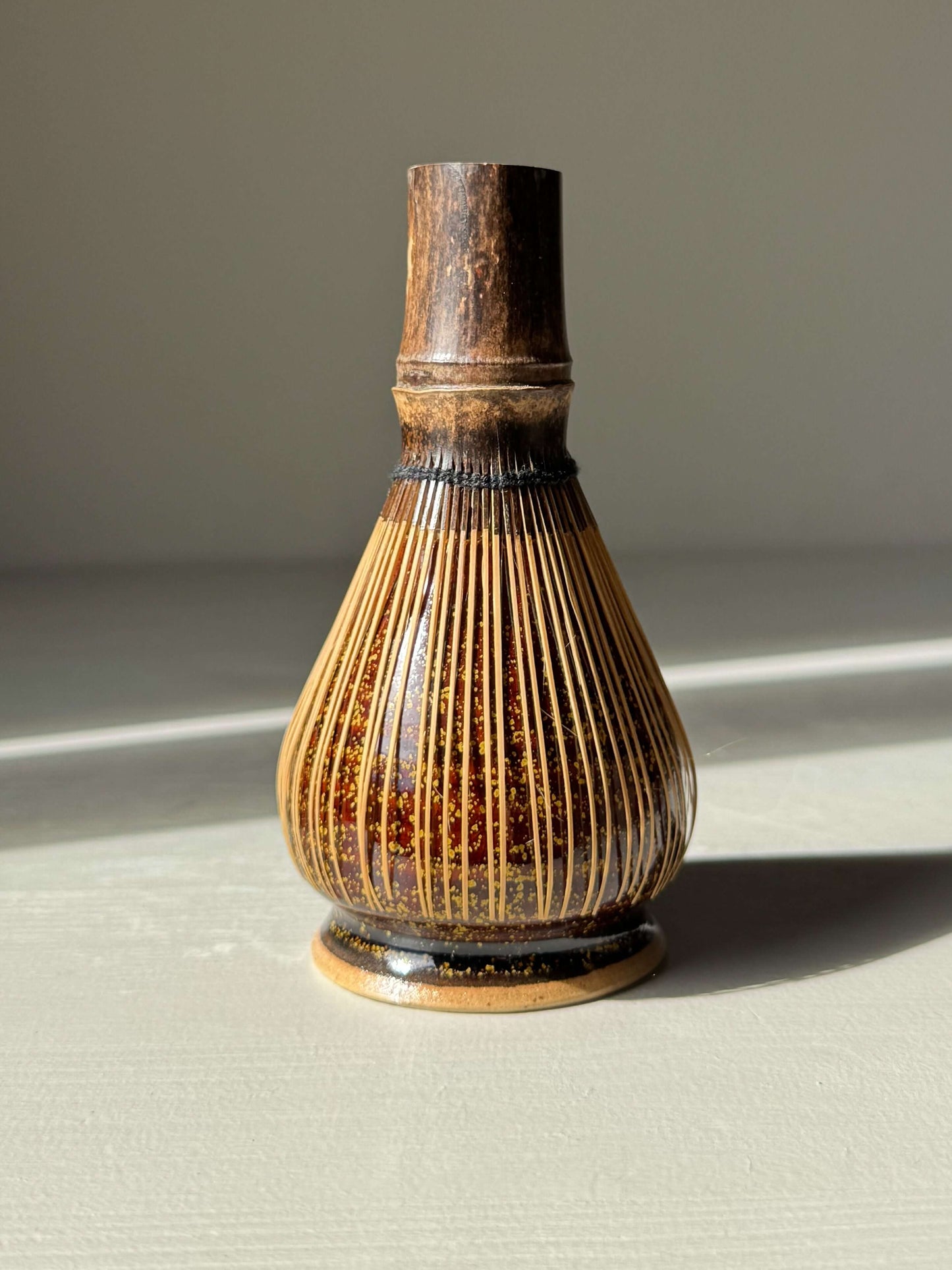 Handmade ceramic Whisk Holder - Kinsei for bamboo matcha whisk with amber glaze, enhancing tea setup aesthetics and whisk longevity.
