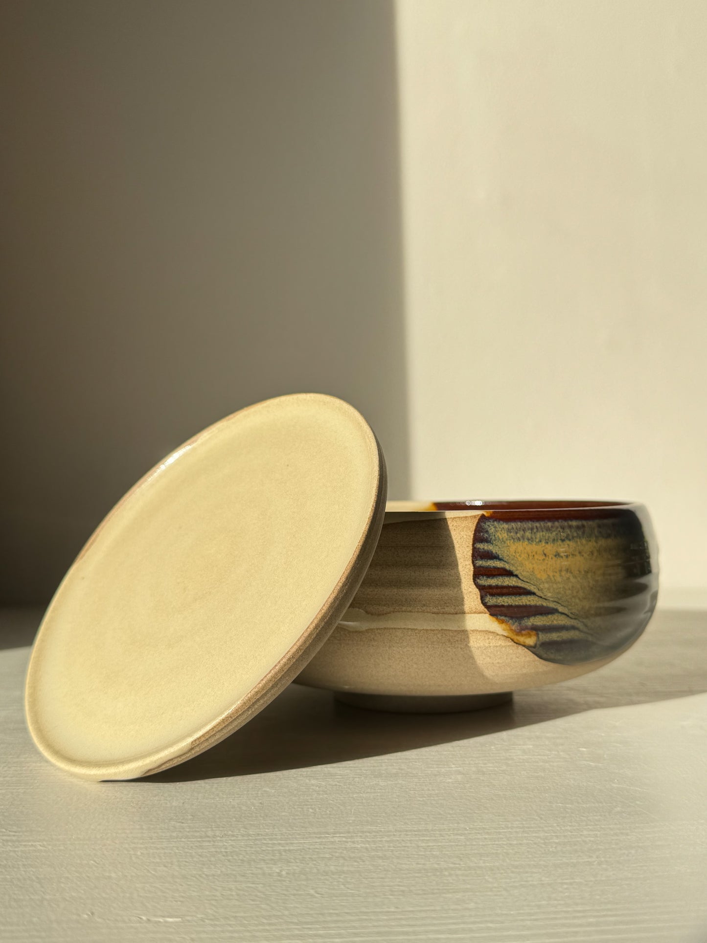 Rounded Berry Bowl - Inyo #01 with matching drip plate, in glossy tenmoku and clear glaze. Ideal for fresh fruit or herbs.