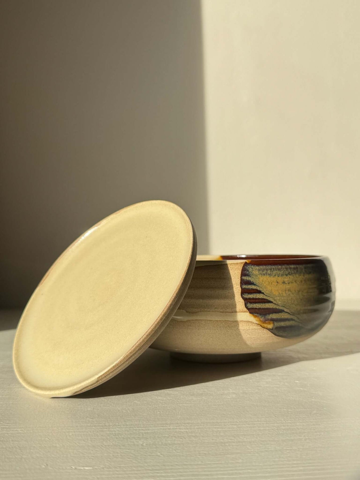 Rounded Berry Bowl - Inyo #01 with matching drip plate, in glossy tenmoku and clear glaze. Ideal for fresh fruit or herbs.