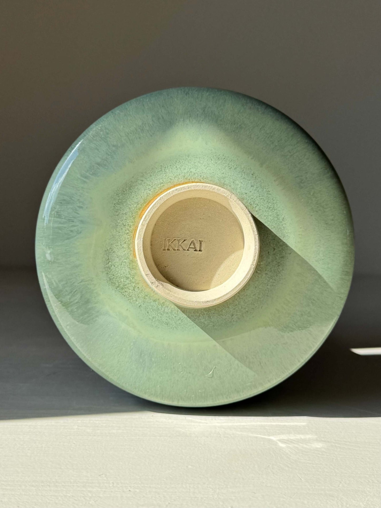 Handmade ceramic, bottom view of Matcha Bowl – Sage Glaze with soft sage-green tone and glossy finish.