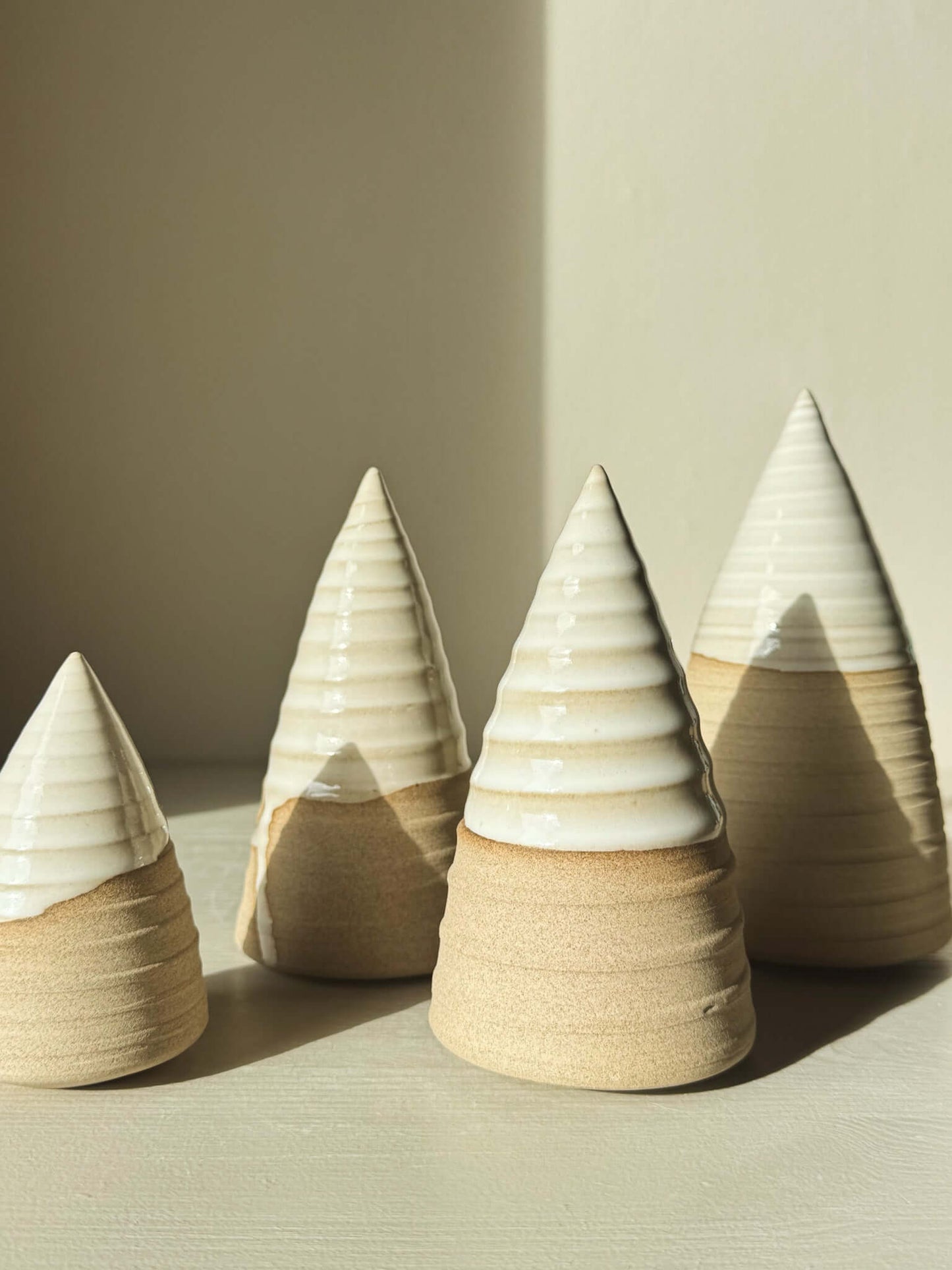 Carved Ceramic Tree – Yuki #01 with glossy white glaze, minimalist design, and hand-carved patterns under soft light.