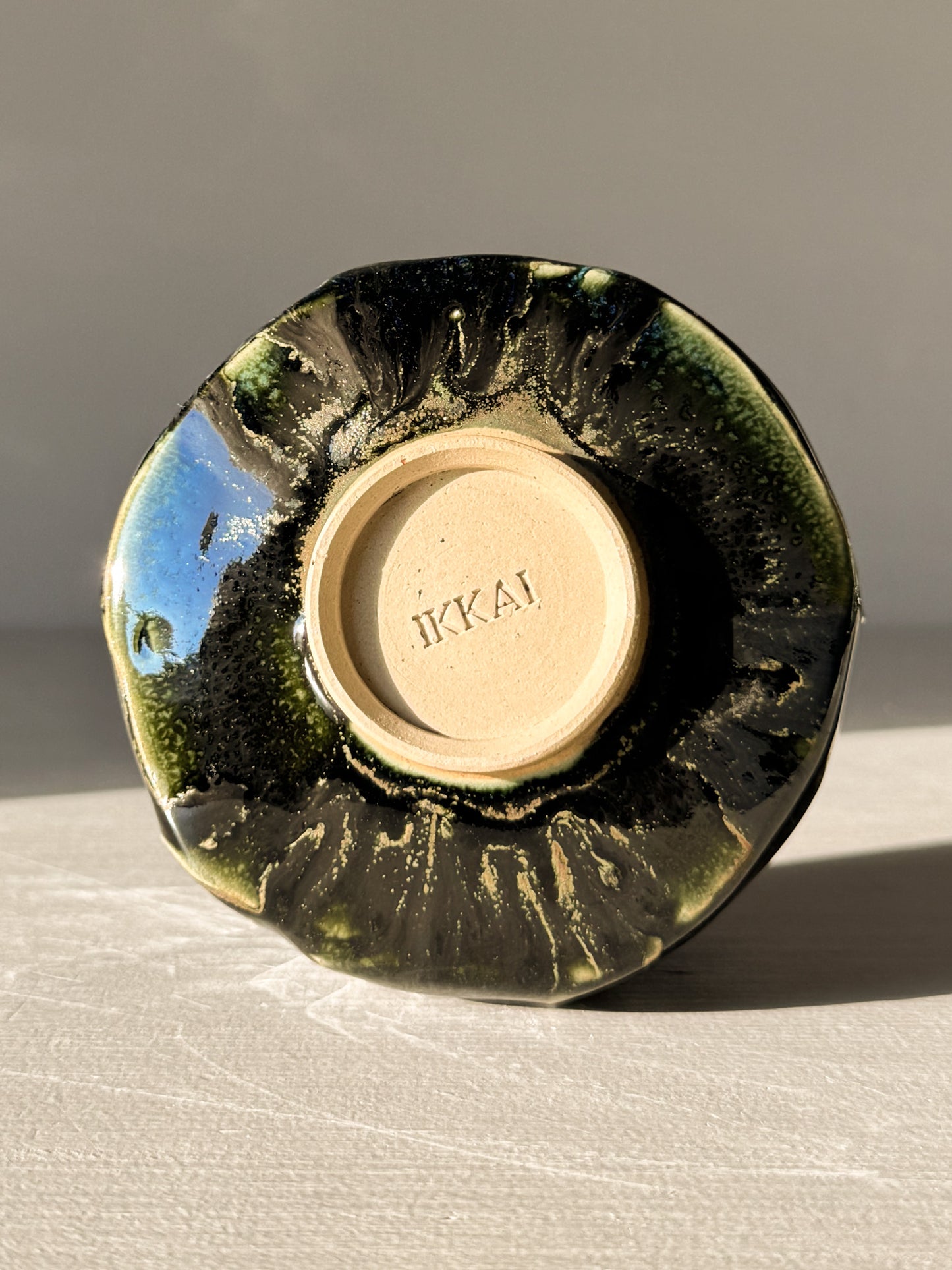 Bottom of Yunomi Cup - Hinoki #05 showing handcrafted texture and deep green glazing