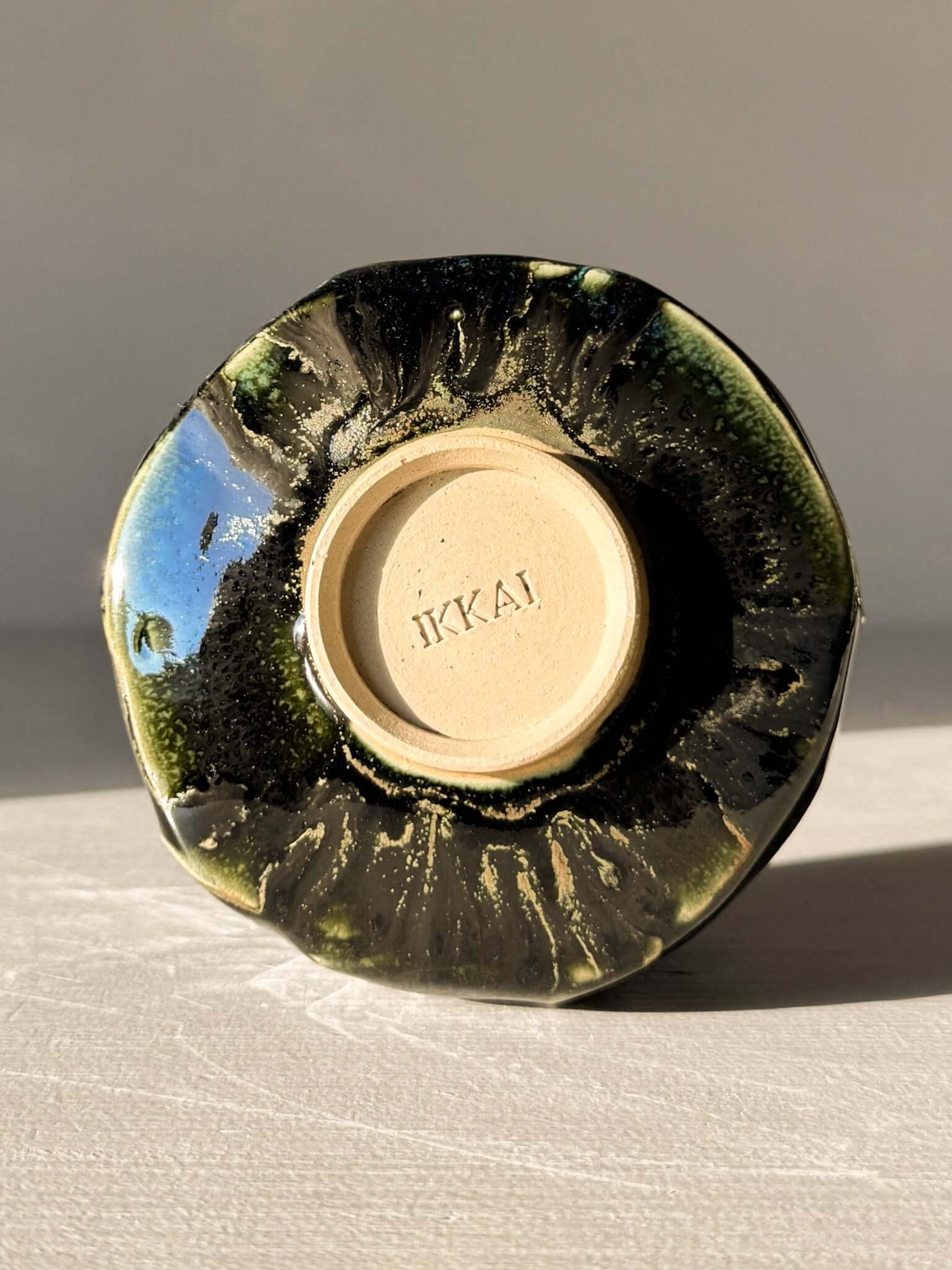 Bottom of Yunomi Cup - Hinoki #05 showing handcrafted texture and deep green glazing