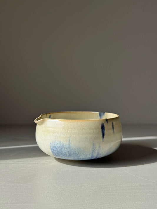 Katakuchi Matcha Bowl with Spout - Cobalt Blue & Moonstone Glaze, handmade ceramic bowl resting in shadows.