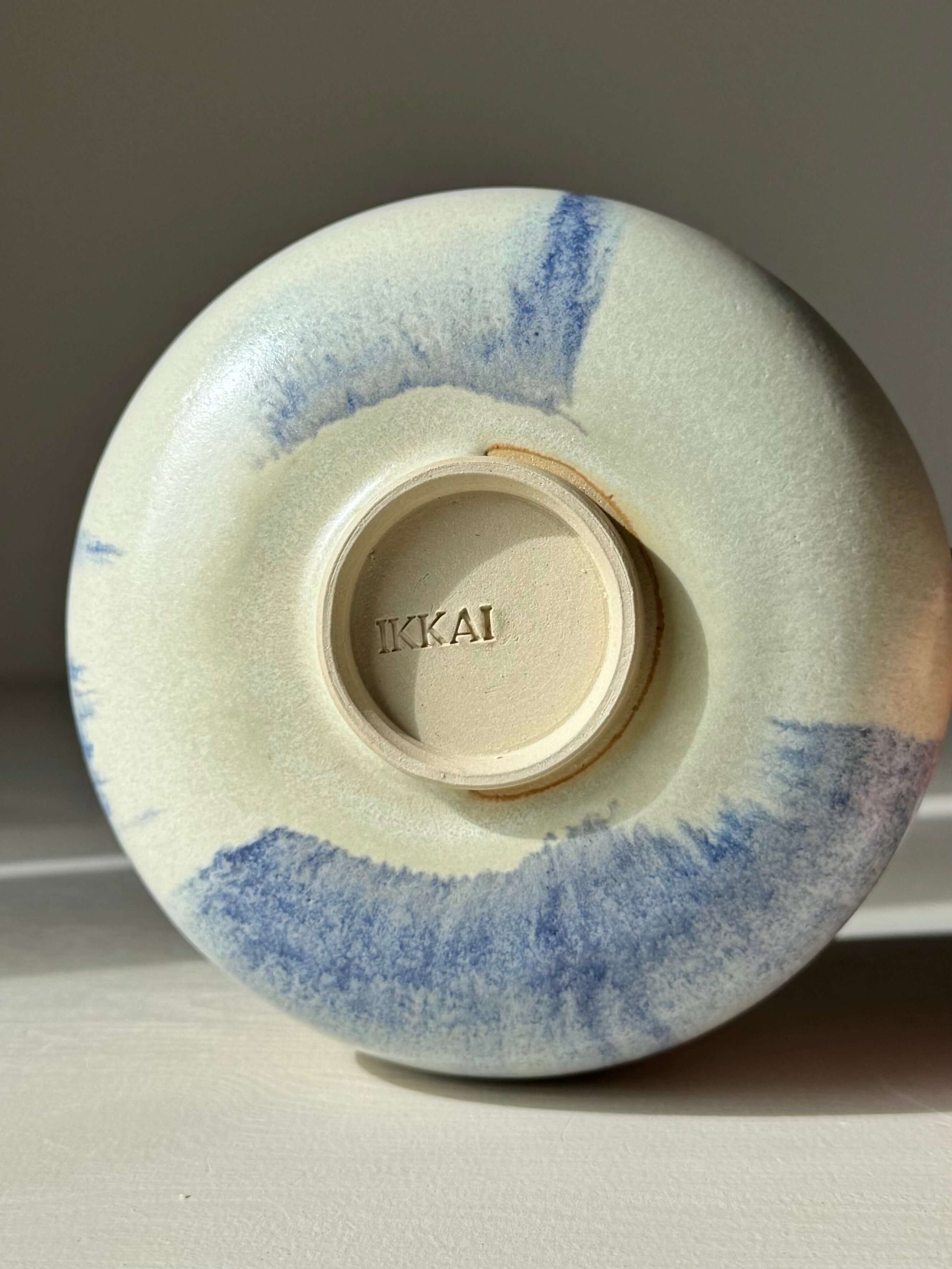 Bottom view of Katakuchi Matcha Bowl with Spout - Cobalt Blue & Moonstone Glaze, showcasing handmade ceramic detail.