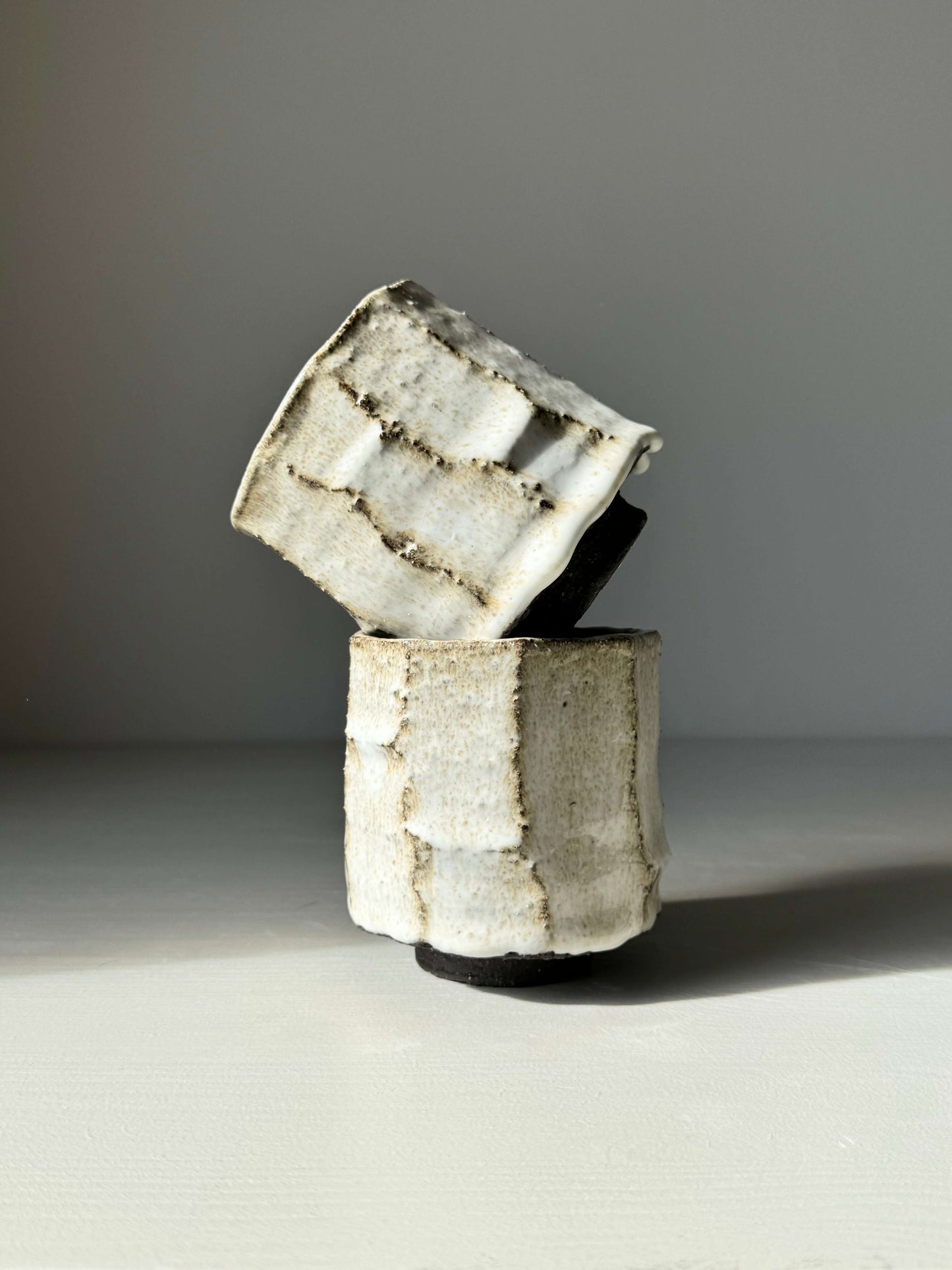 Kurinuki style cup set with nuka glaze, showcasing hand-carved earthy texture and organic design, inspired by traditional Japanese techniques.