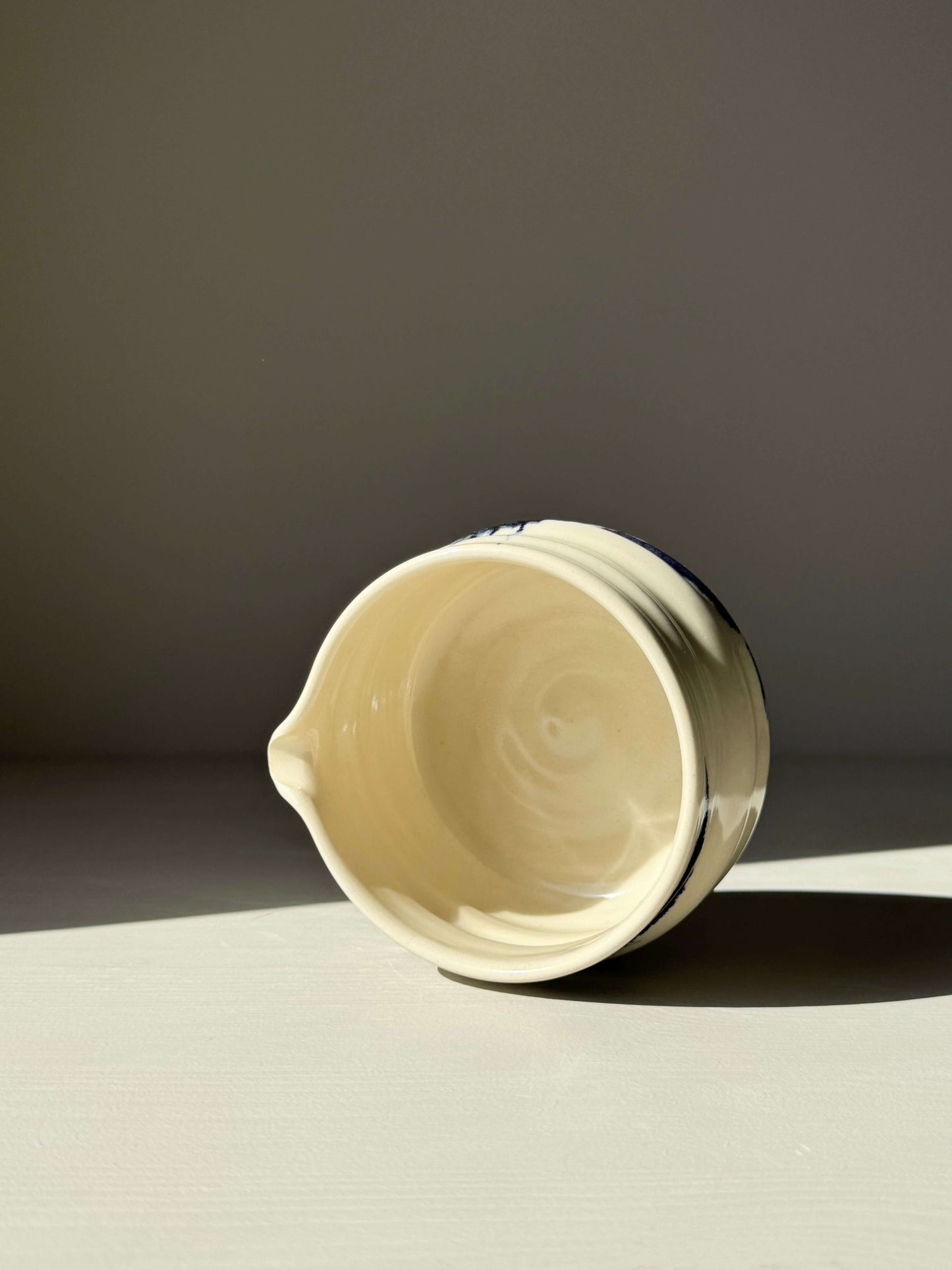 Gosu Series matcha bowl with spout, cobalt blue accents on clear glaze, handmade pottery design for whisking matcha.