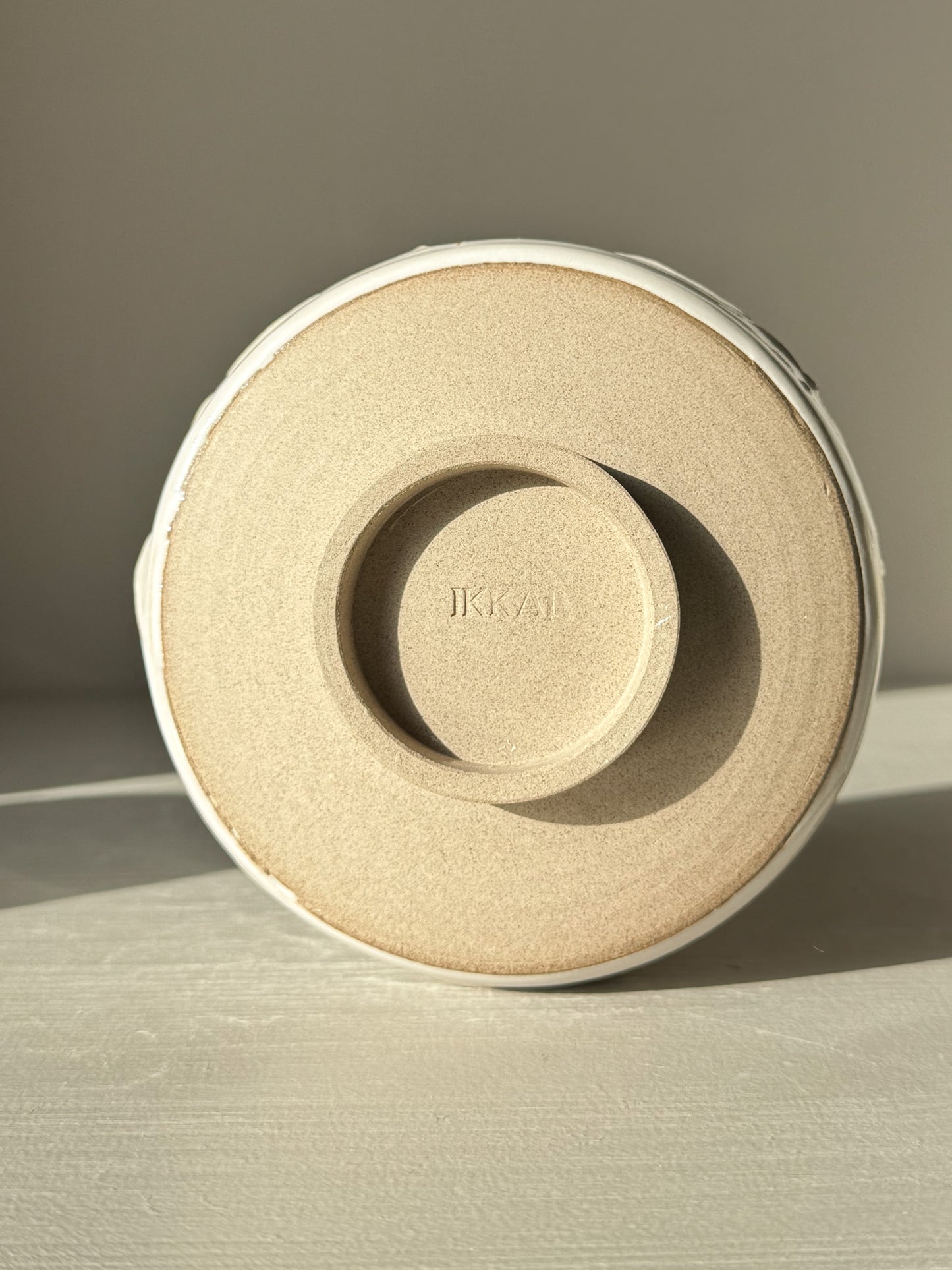 Bottom view of Matcha Bowl – Yuki Branches #03 showcasing its textured base and subtle markings, highlighting its artisanal craftsmanship.