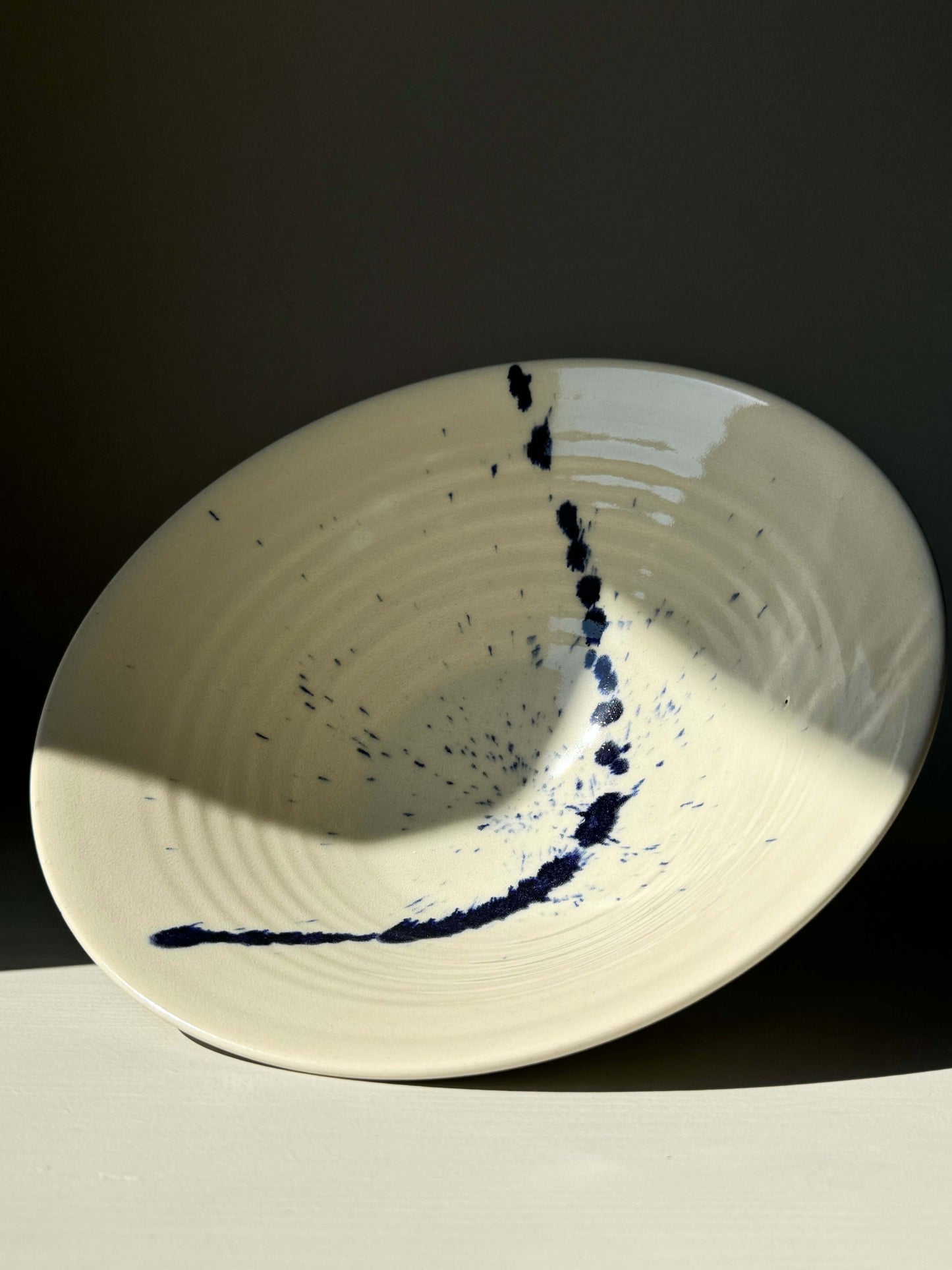 Gosu Series serving bowl with navy accents, inspired by traditional Japanese forms, showcasing a clean, elevated design.