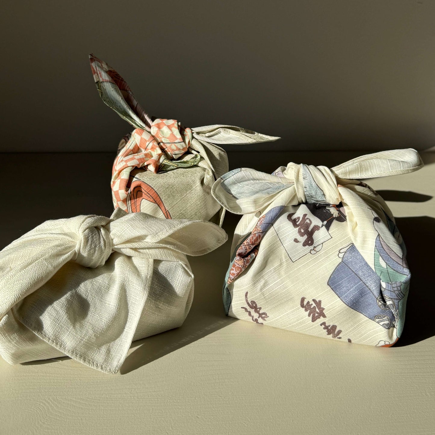 three furoshiki wrapped presents