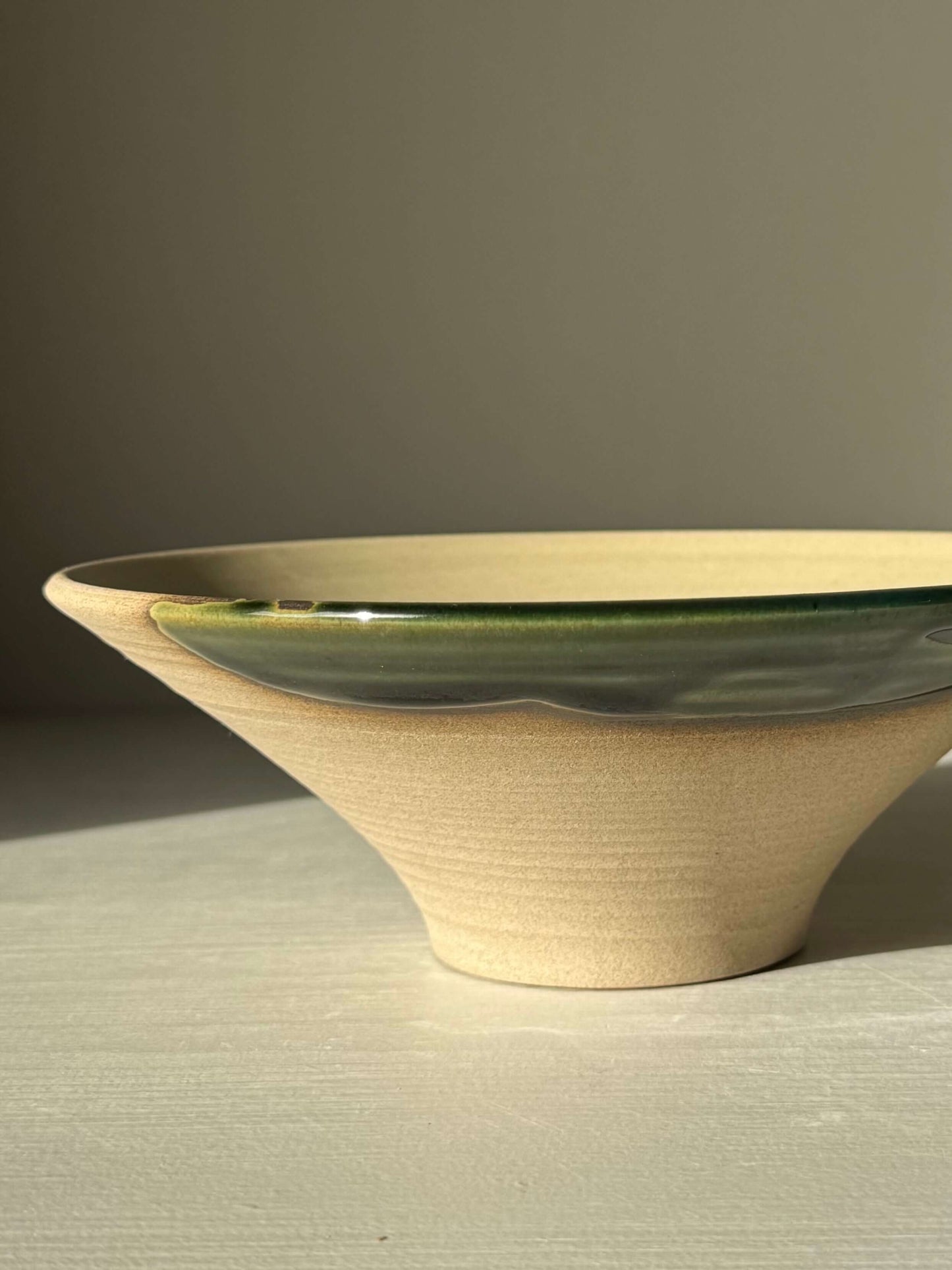 Small Serving Bowl - Mori #01 with glossy green glaze and toffee clay, handmade ceramic art piece showcasing gradient colors and calming curves.