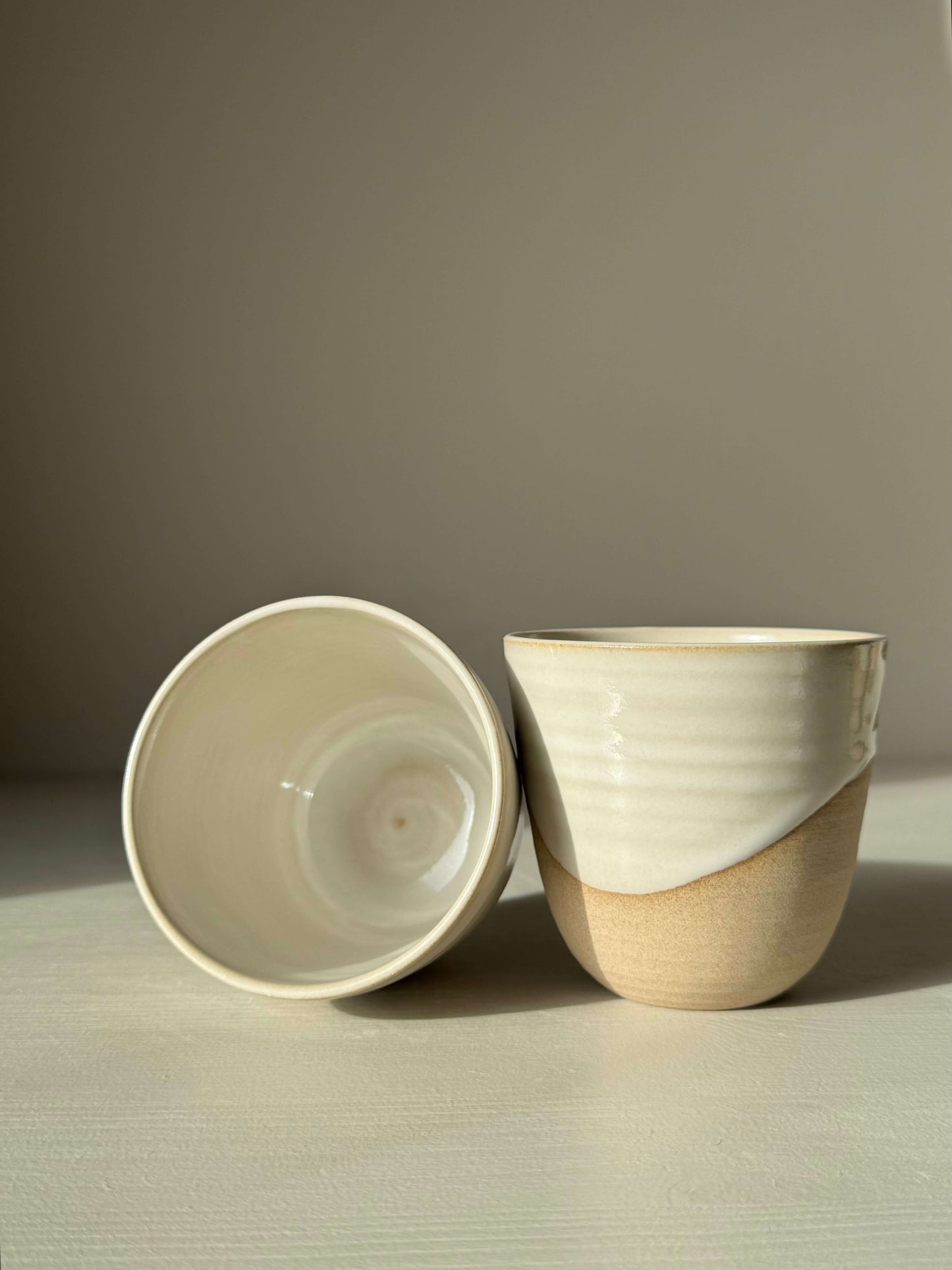 Handmade ceramic Stackable Latte Cups - Yuki with glossy white glaze and warm toffee clay, showcasing unique handmade craftsmanship.