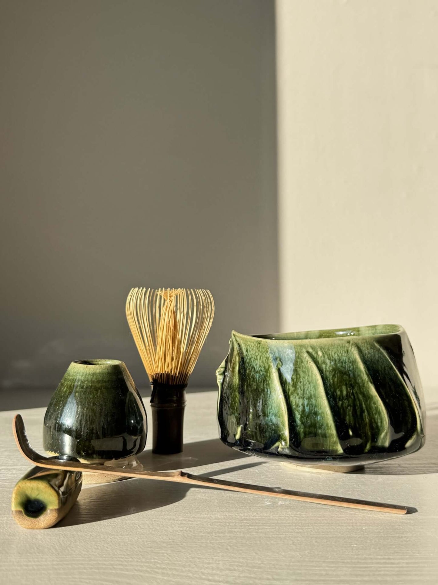 Textured Matcha Bowl - Hinoki #11 with green glaze and textured finish alongside traditional tea tools