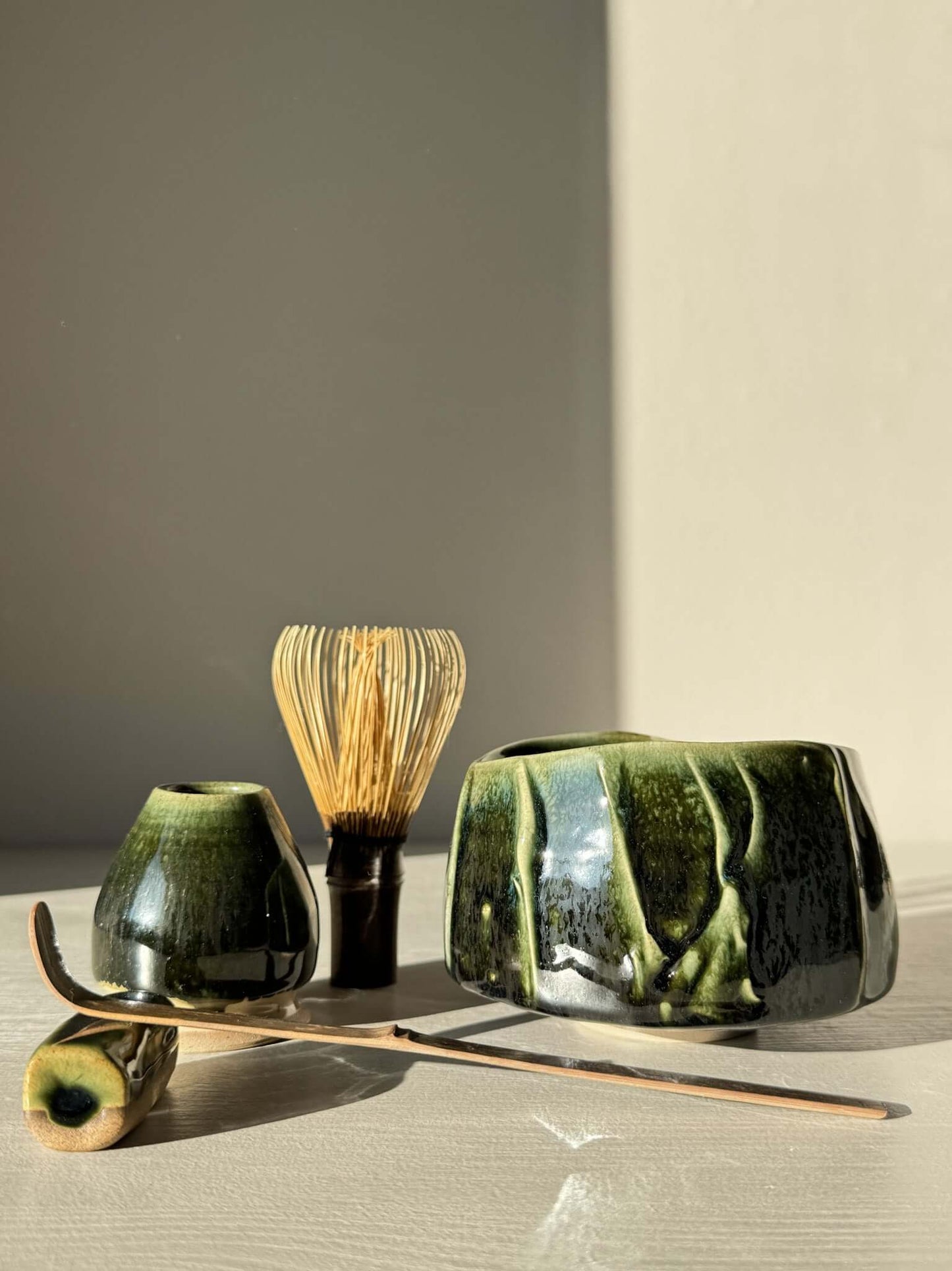 Textured Matcha Bowl - Hinoki #16 with bamboo whisk and tea accessories, showcasing green glaze and textured finish.