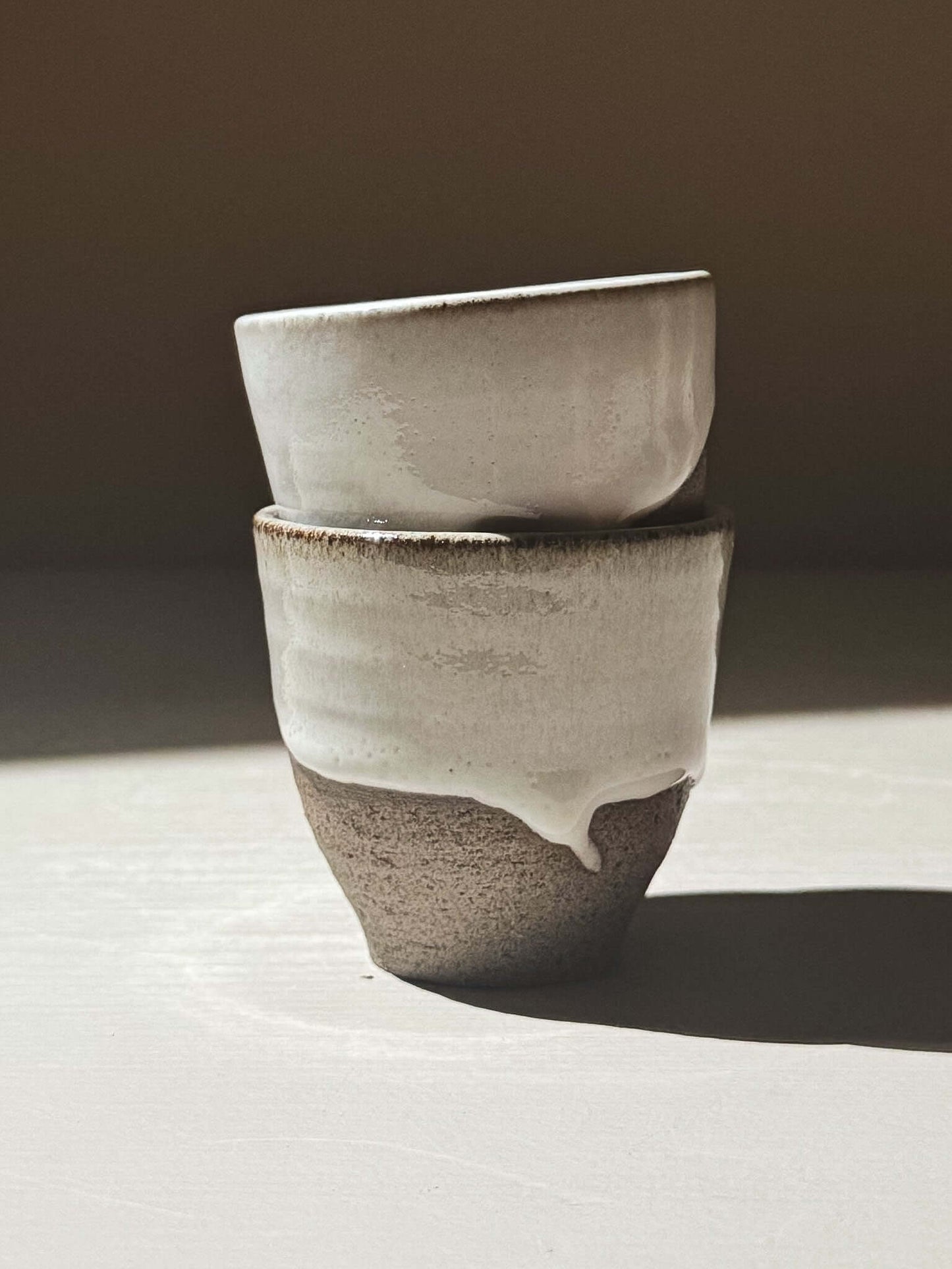 Espresso Cup - Yuki Ash, handmade stoneware cup with glossy white glaze and textured clay.