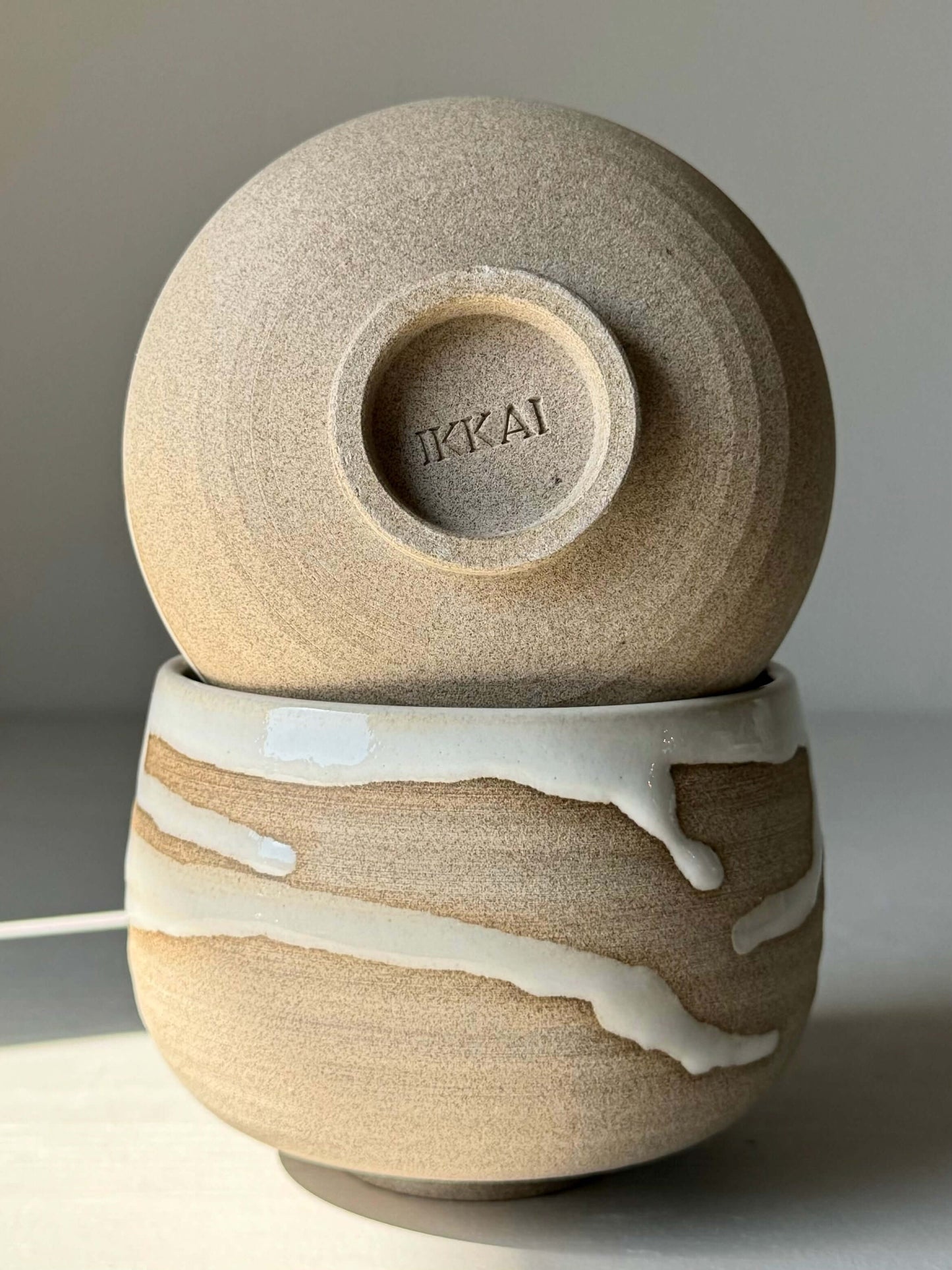 Yuki Series coffee cups, with a toffee clay body and unique white glaze design, showcasing handcrafted elegance and individuality.