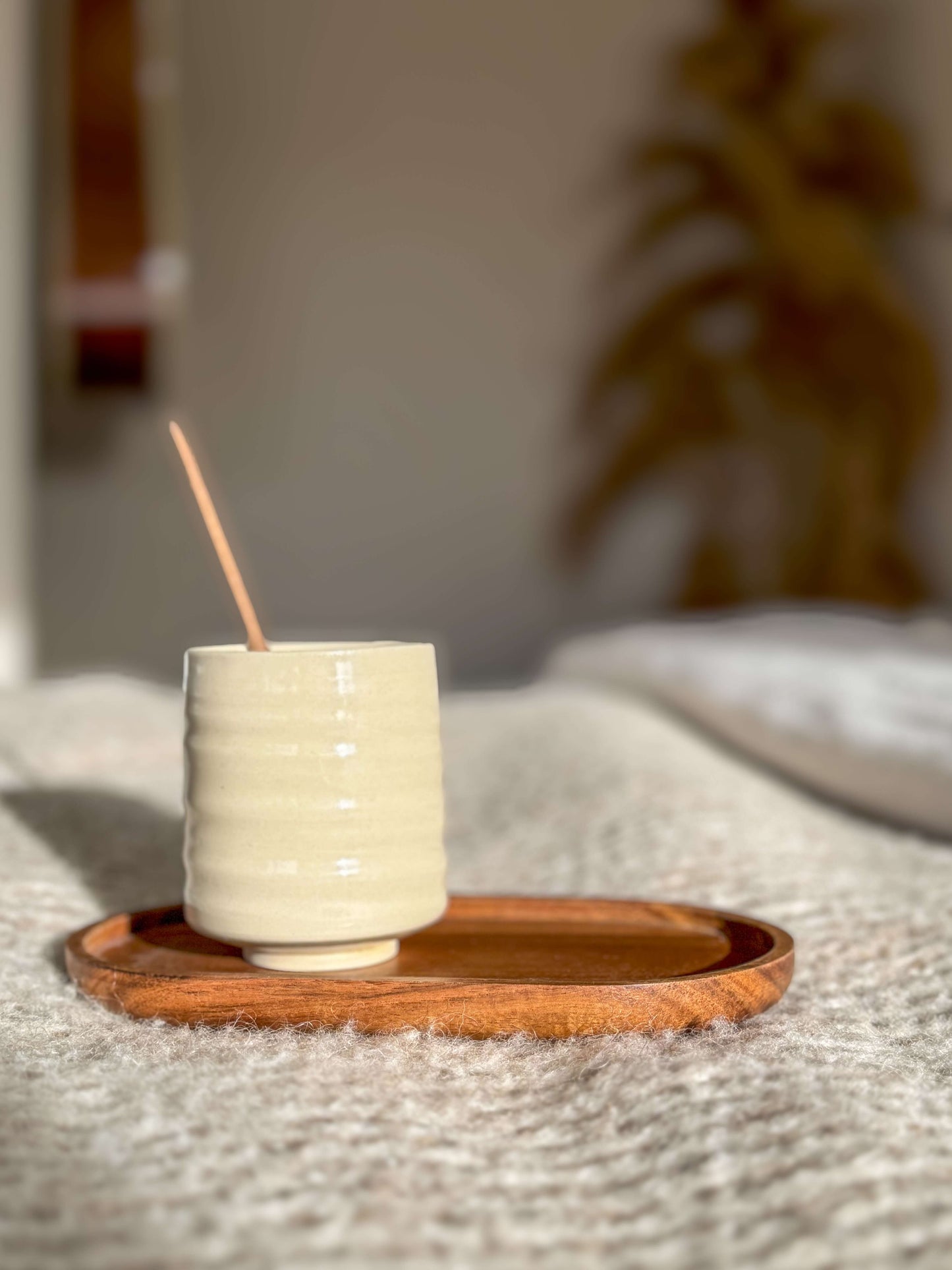 Wheel-thrown Yunomi Cup with clear glaze on wooden tray, showcasing refined design and natural clay beauty. 225ml capacity.