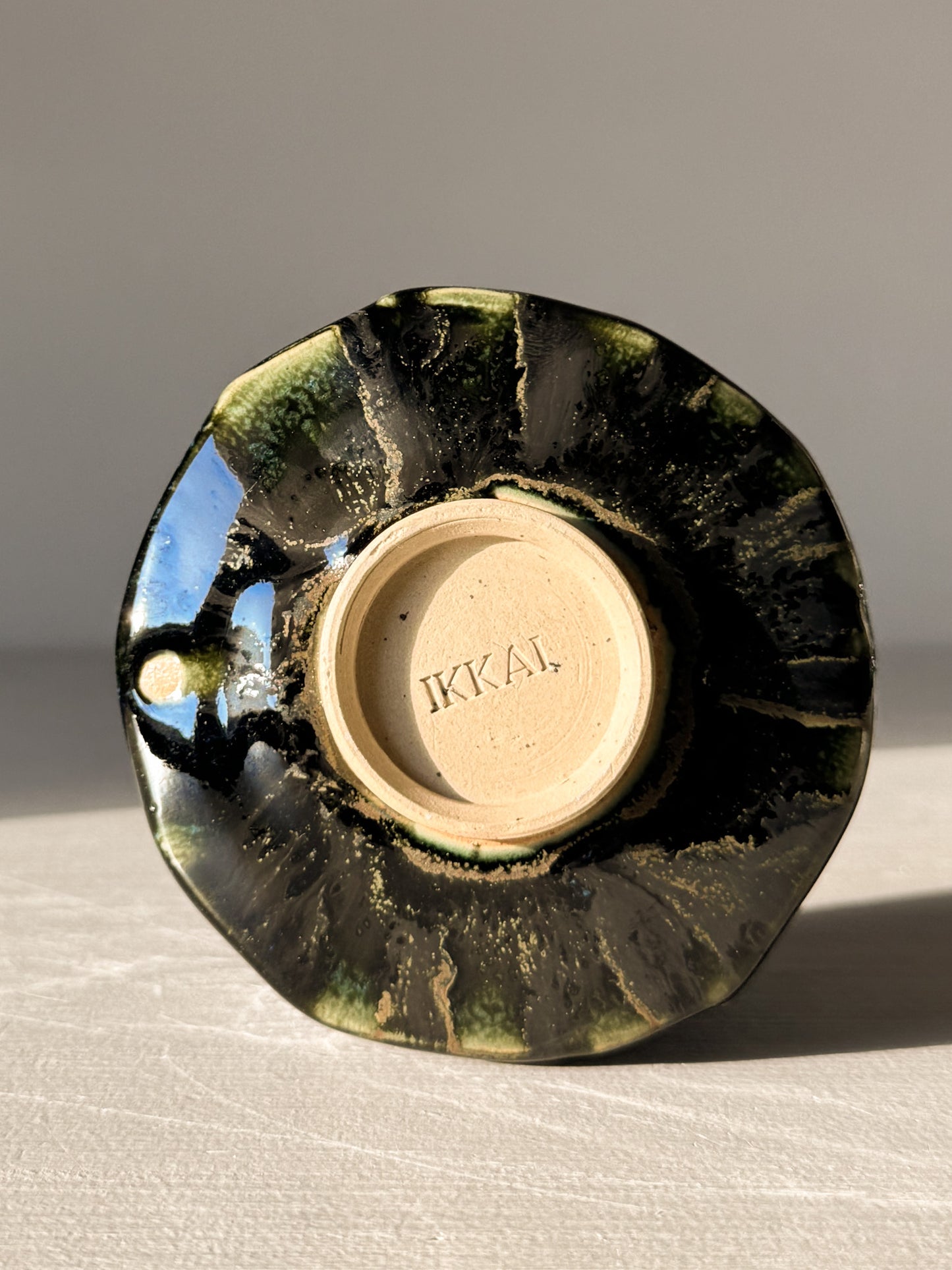 Yunomi Cup - Hinoki #06 with deep green glaze and unique handmade design in the Hinoki Series, showcasing subtle texture and artistry.