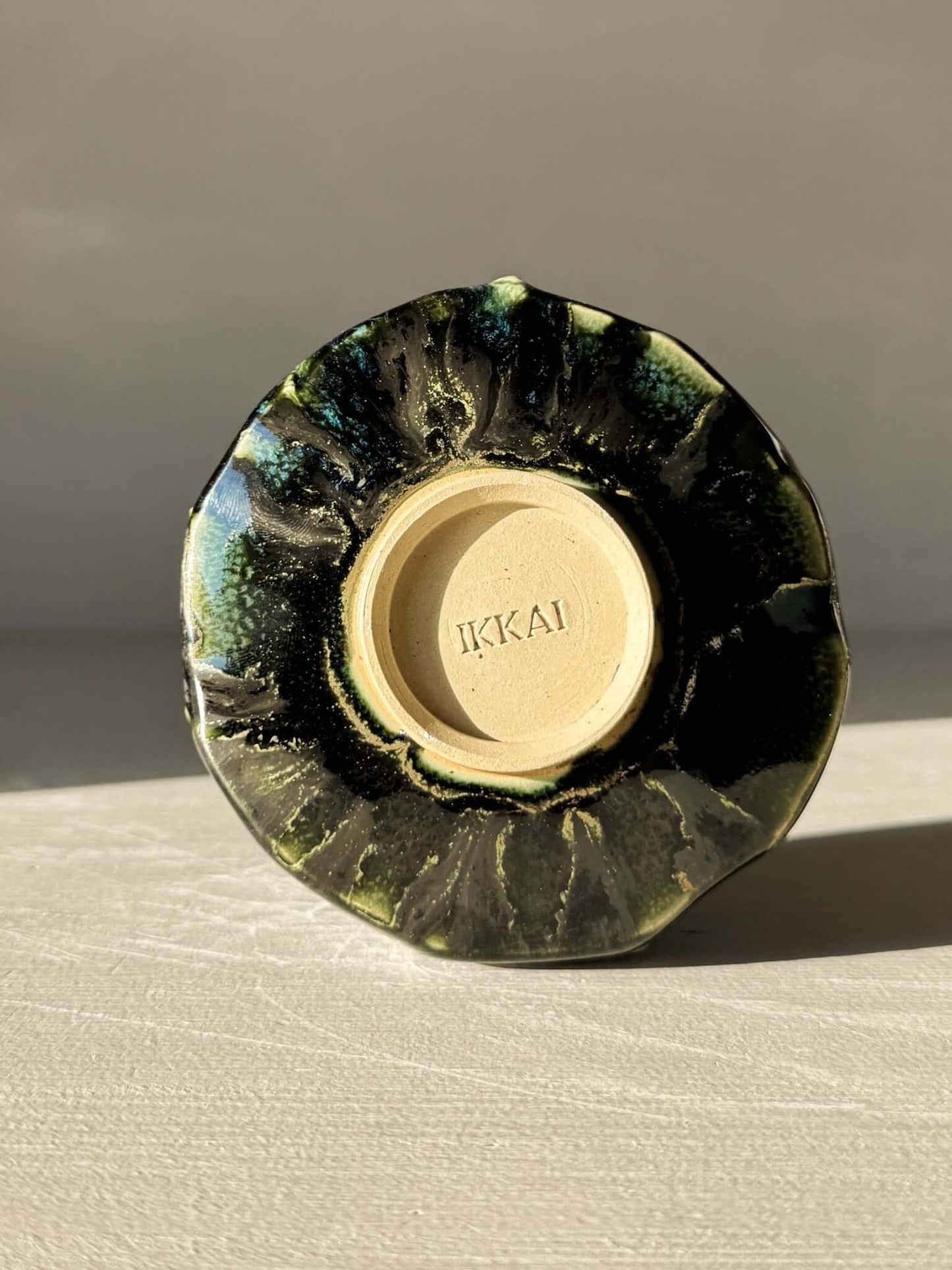 Base view of Yunomi Cup - Hinoki #07 with unique glaze pattern highlighting subtle texture and handcrafted artistry.